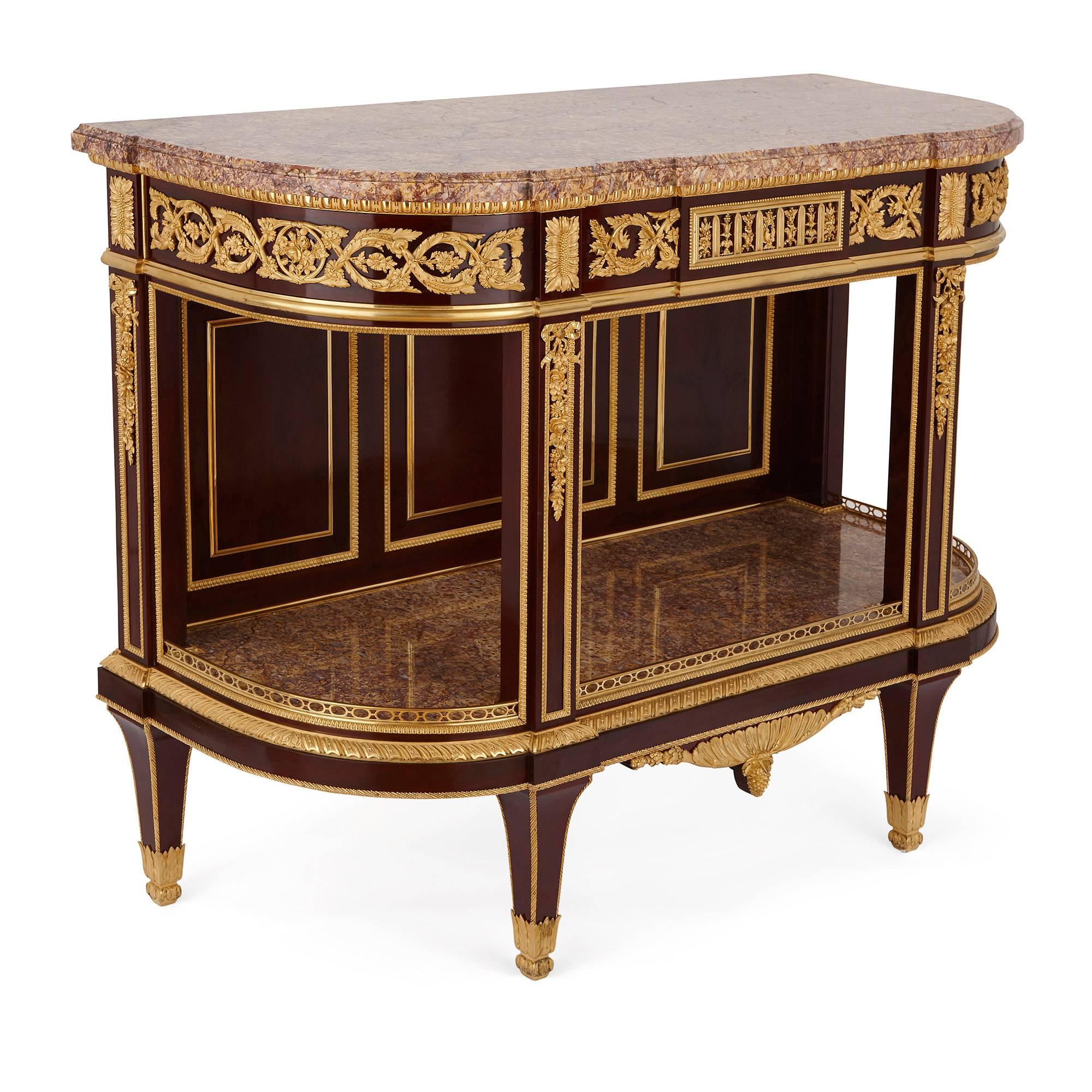 The dessert console with ormolu mounts and parcel-gilt spade legs, with a veined marble top, the frieze below decorated with foliate and garland motifs, with a central drawer, stamped and dated on the back 'Henry Dasson / 1886'.