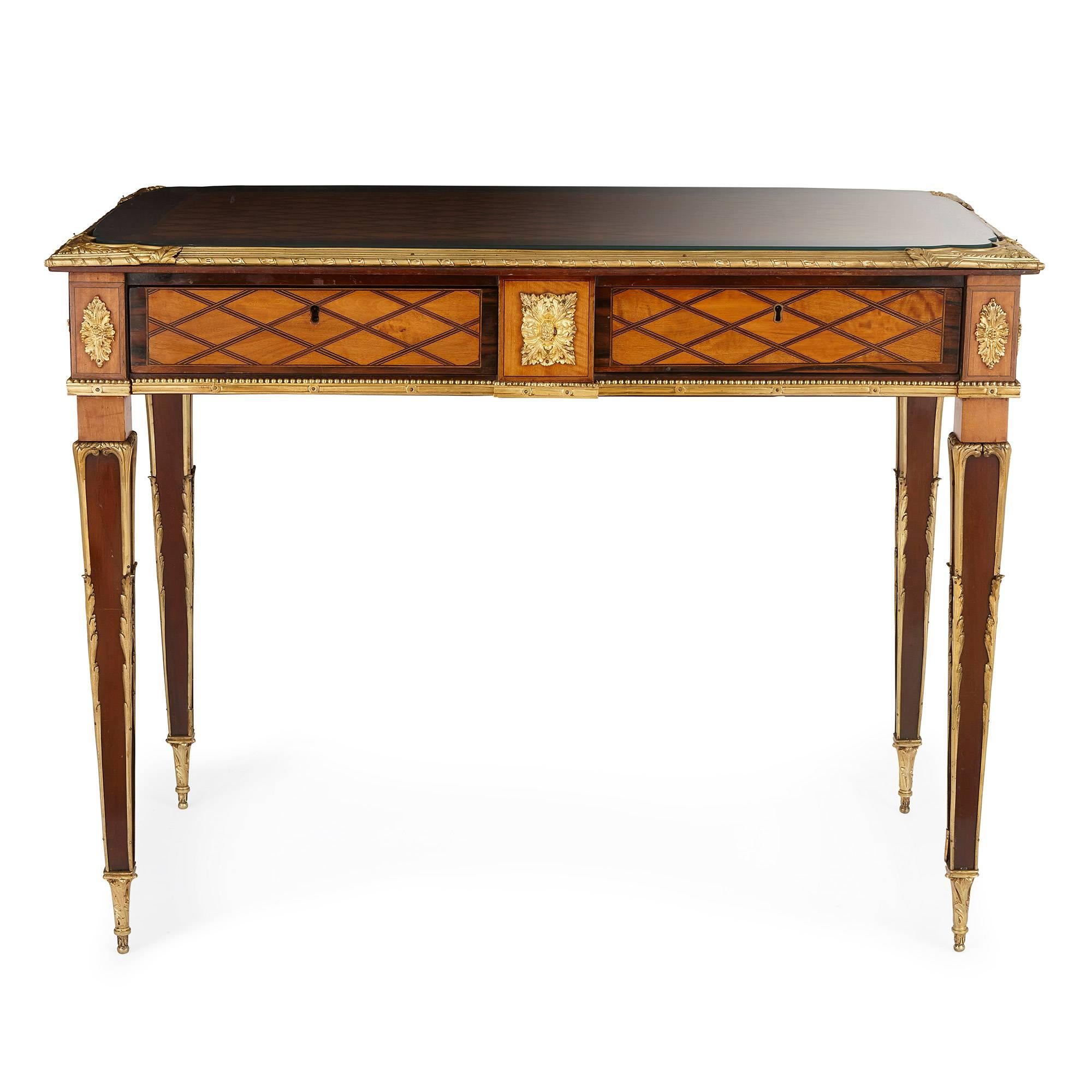 On tapered legs with ormolu mounts, the rectangular mahogany desk decorated extensively with intricate satinwood and rosewood parquetry work.

This rare bureau is one of the finest examples of Ross’ work and the model has been reproduced as tables