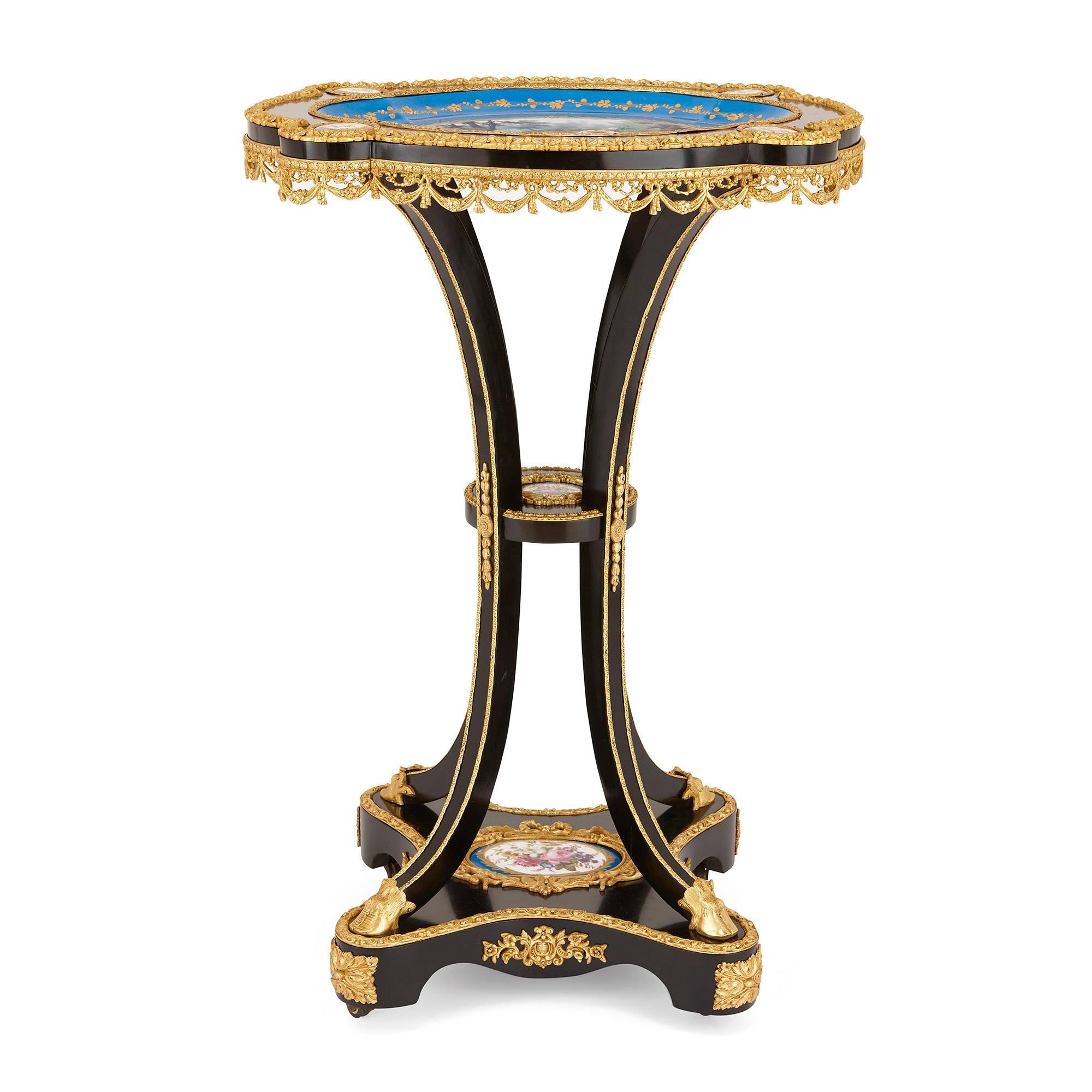 Ebonised wood table with Sèvres-style porcelain and ormolu mounts
French, 19th Century
Height 73cm, width 50cm, depth 41cm

Decorated with beautiful Sèvres-style porcelain panels, this elegant side table has a highly unusual shape and design.

A