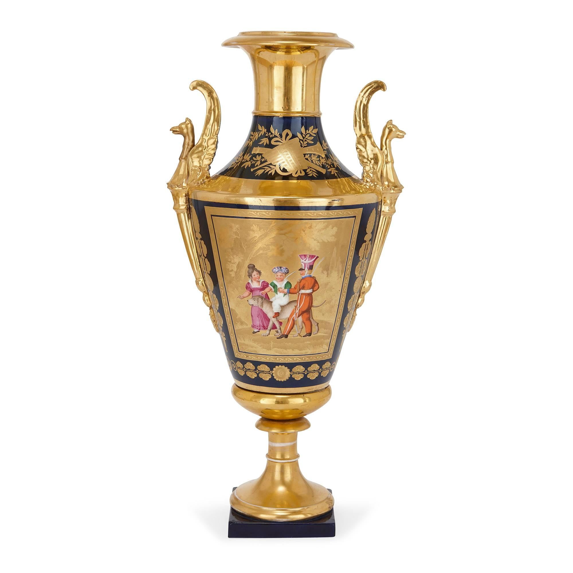 Of conical shape with retracted neck and griffin handles, the 'fond lapis' parcel-gilt and painted surface depicting on one side a colourful scene with children and on the other a bouquet of flowers, with a cobalt blue ground with gold leaf borders
