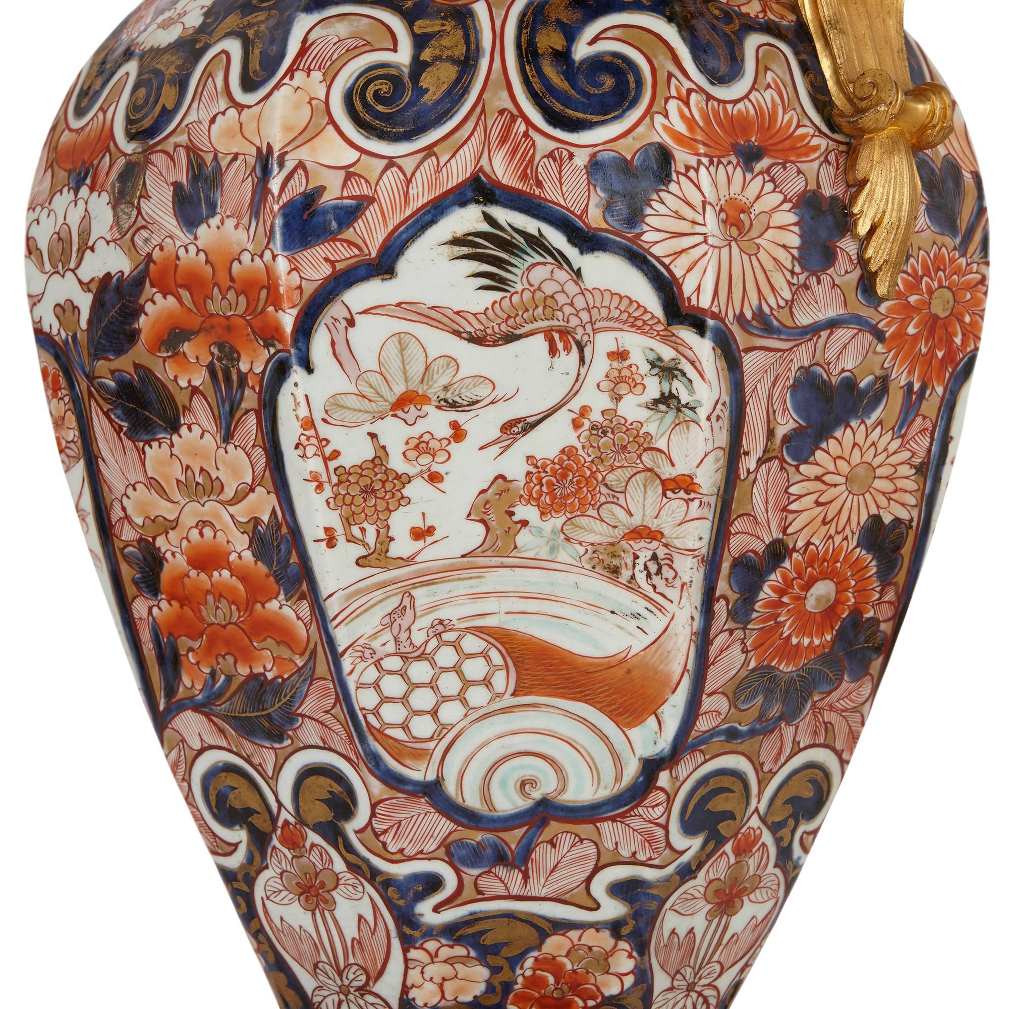 Decorated throughout with floral patterns; the porcelain Japanese, circa 1700, the ormolu French, 19th century.

These stunning antique Japanese vases are examples of exceptionally high quality Imari Porcelain ware, which is renowned for its