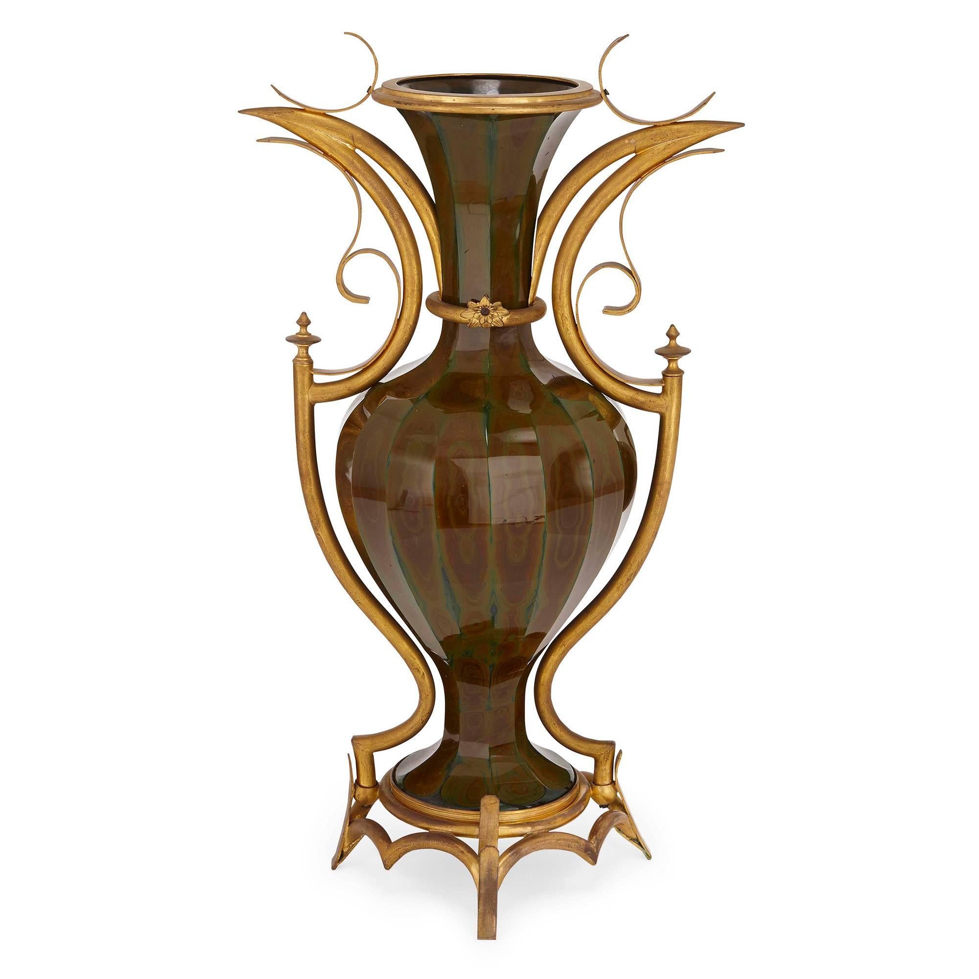The two vases of ovoid form, the Lithyalin glass bodies canted with flared necks and bases, supported by scrolling ormolu mounts to the sides and bases

The fine pair of vases attributed to the Saint Louis Glassworks (French, f. 1767)

Lithyalin