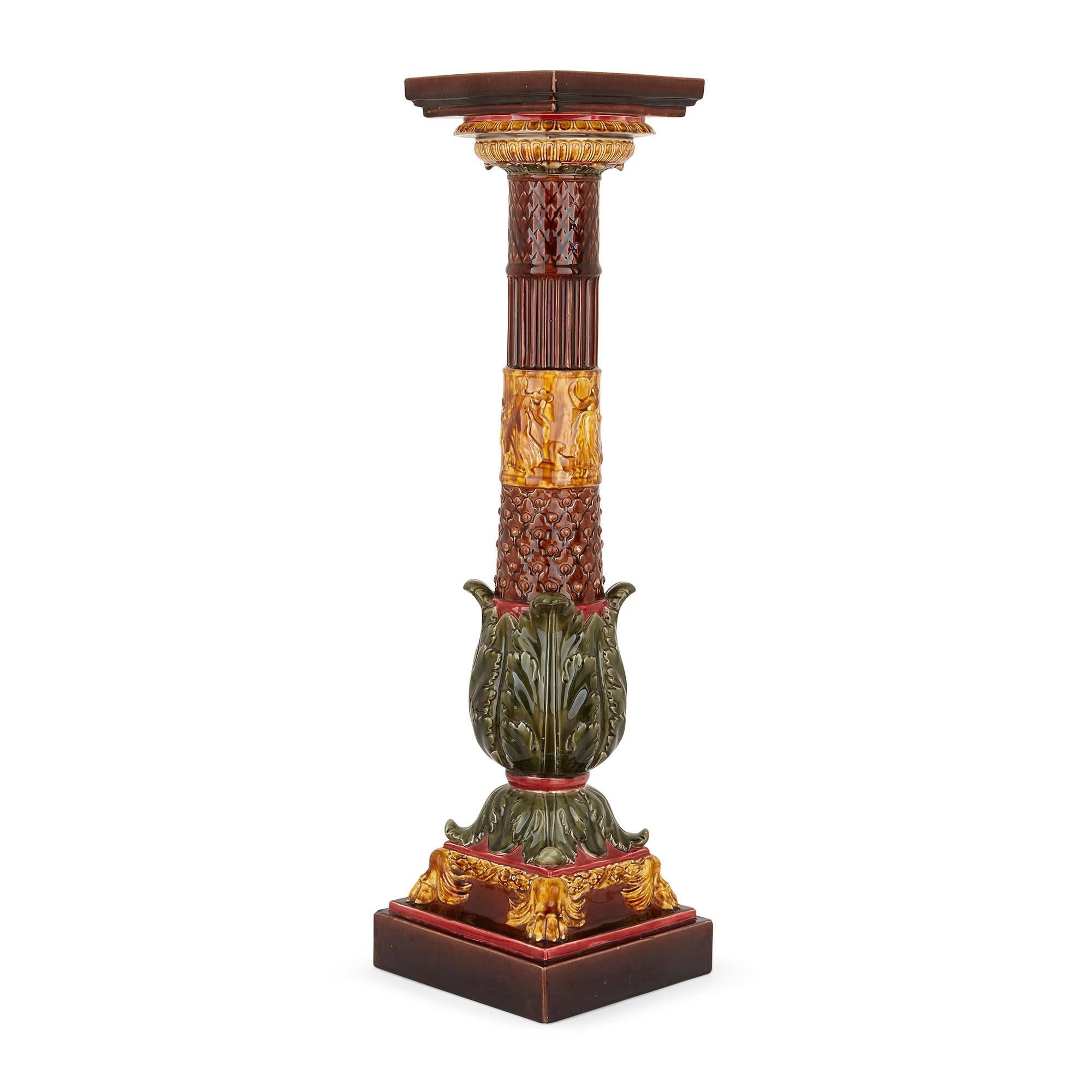 This shape of this fine antique pedestal takes inspiration from the architecture of Classical Greece and Rome. The decoration, however, is of a later style, with maroon, amber and green vegetal and floral embellishments depicted in the Arts and