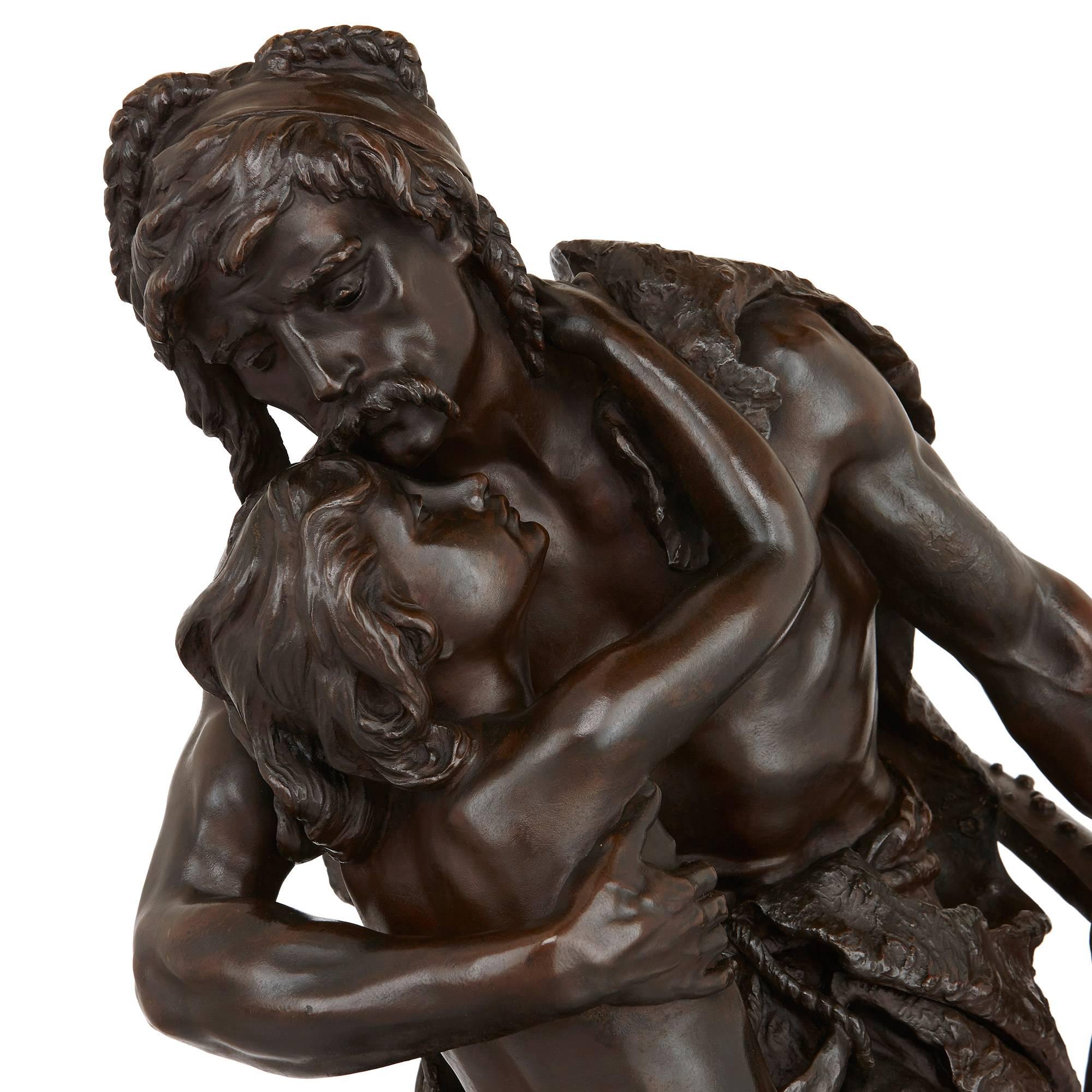 This beautiful antique French sculpture depicts a tender moment between father and son. Made of fine patinated bronze, the full length figures of father and son are crafted in the naturalistic style that is typical of Plé's work. The father is