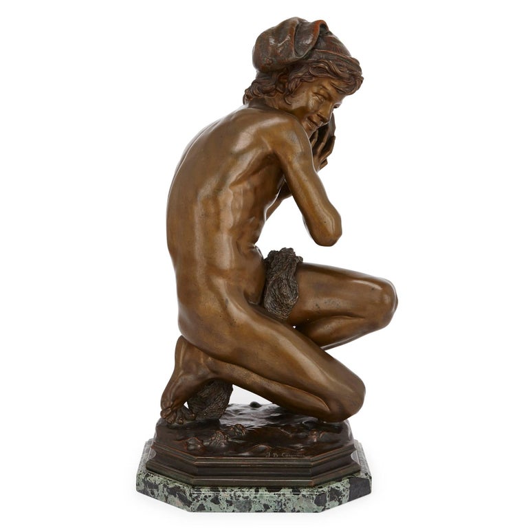 This beautiful patinated bronze sculpture was designed by Jean-Baptiste Carpeaux, and cast by the Susse Frères foundry. The work portrays a young Neapolitan fisherboy, who sits on a naturalistic base, crouched holding a shell to his ear. The work is
