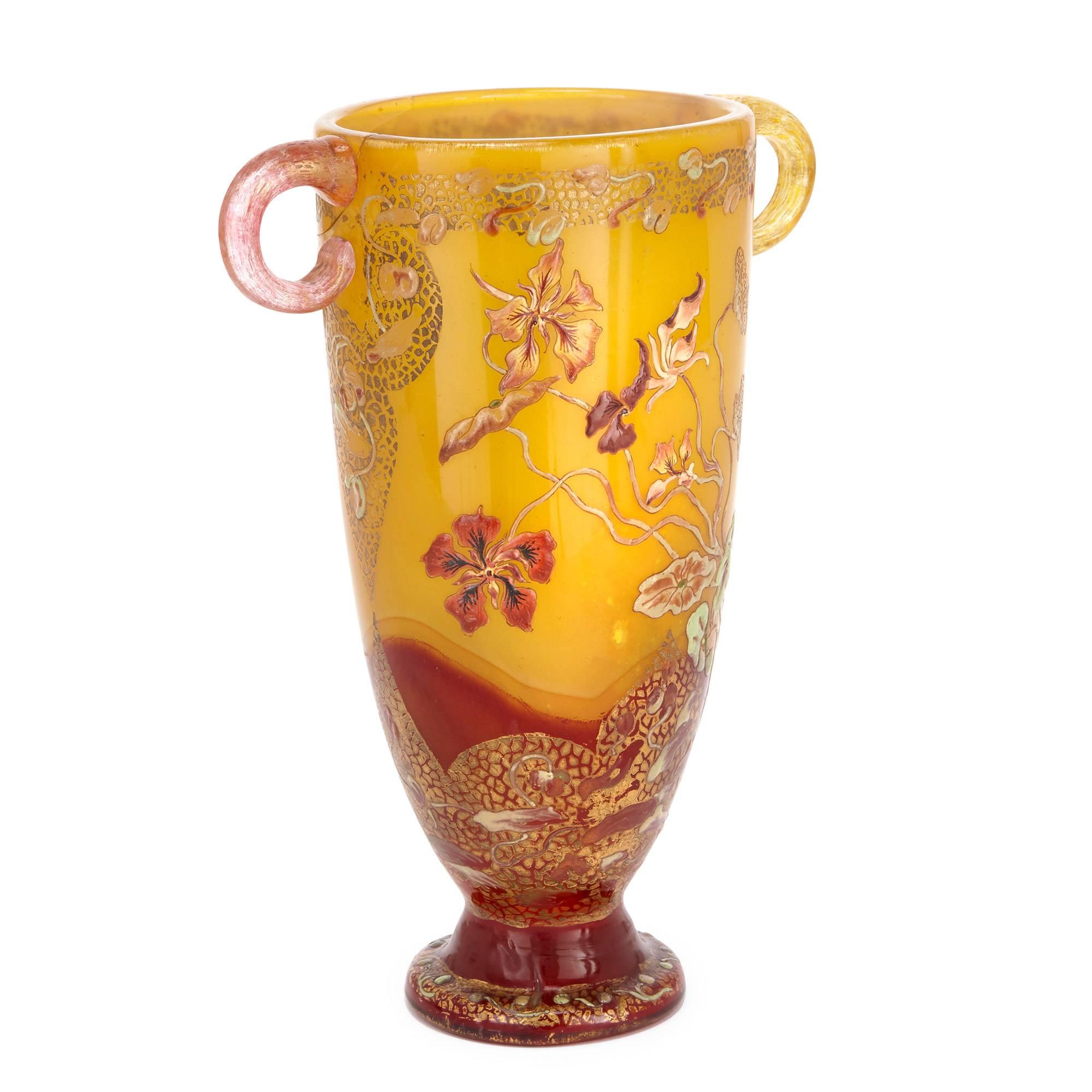 This stunning Art Nouveau vase is of fine yellow glass, featuring a floral design that is embellished with gold highlights. The vase is signed to the body with Gallé's mark.

Émile Gallé (1846-1904) was an artisanal French glassmaker, who is