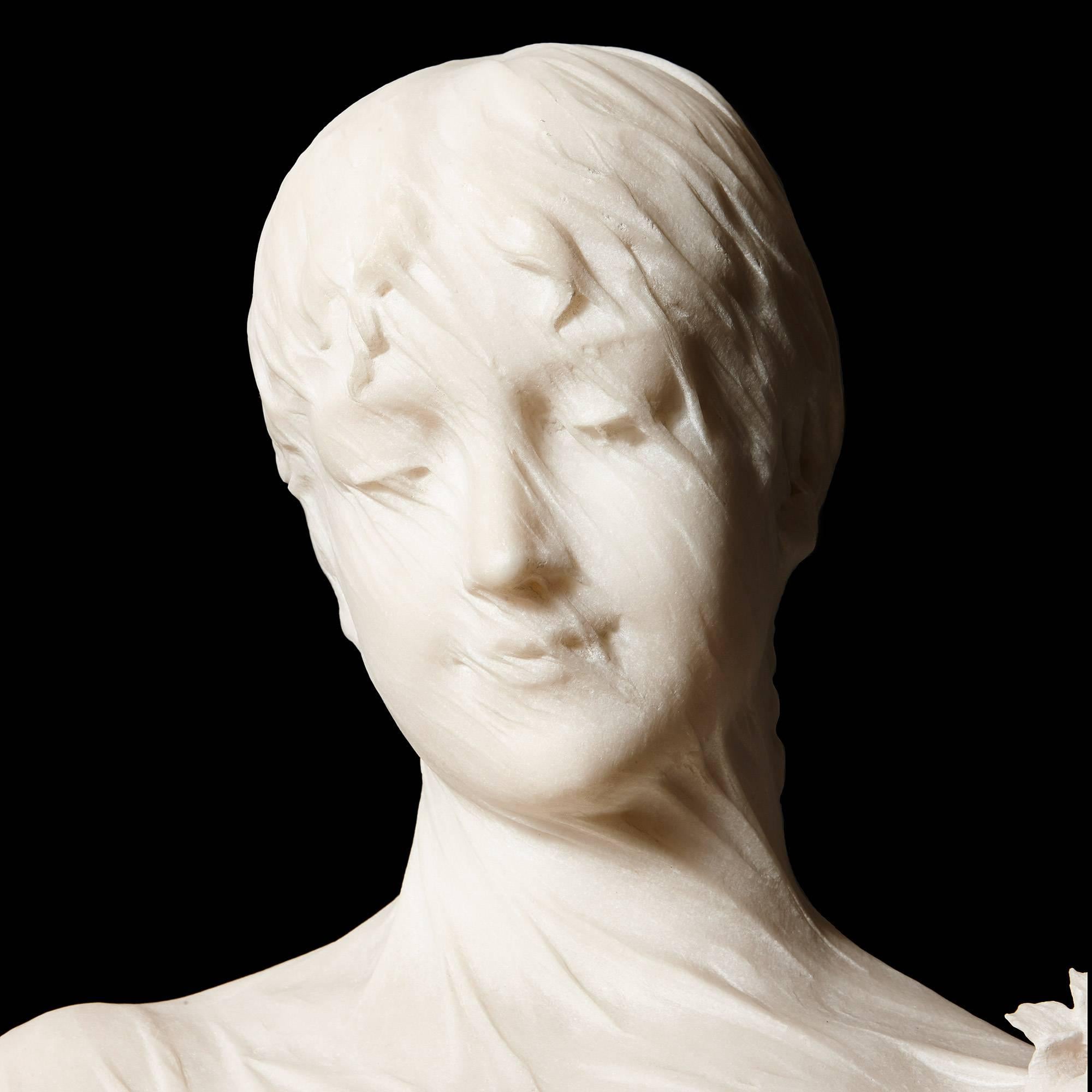 This beautiful Italian bust captures a moment of intimacy and calm, depicting a young lady with her eyes closed and a veil over her head with an impressive degree of naturalism. The work is signed on the reverse, 'C. Lapini / Firenze