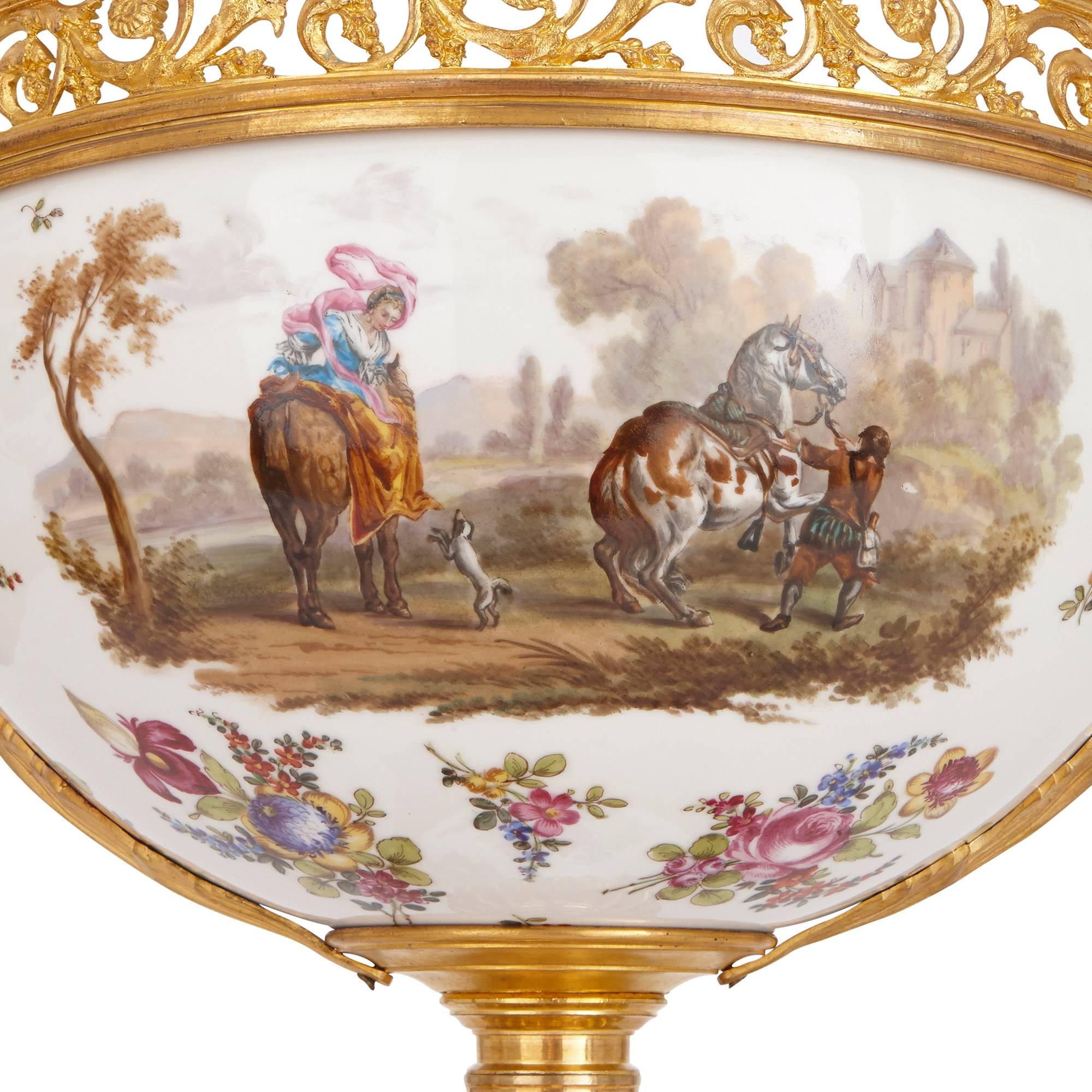 This stunning antique garniture comprises a central jardiniere and a pair of flanking vases, each decorated with figures and horses in landscapes on white ground French

Jardiniere height 49cm, width 487cm, depth 34cm
Vases height 69cm, width