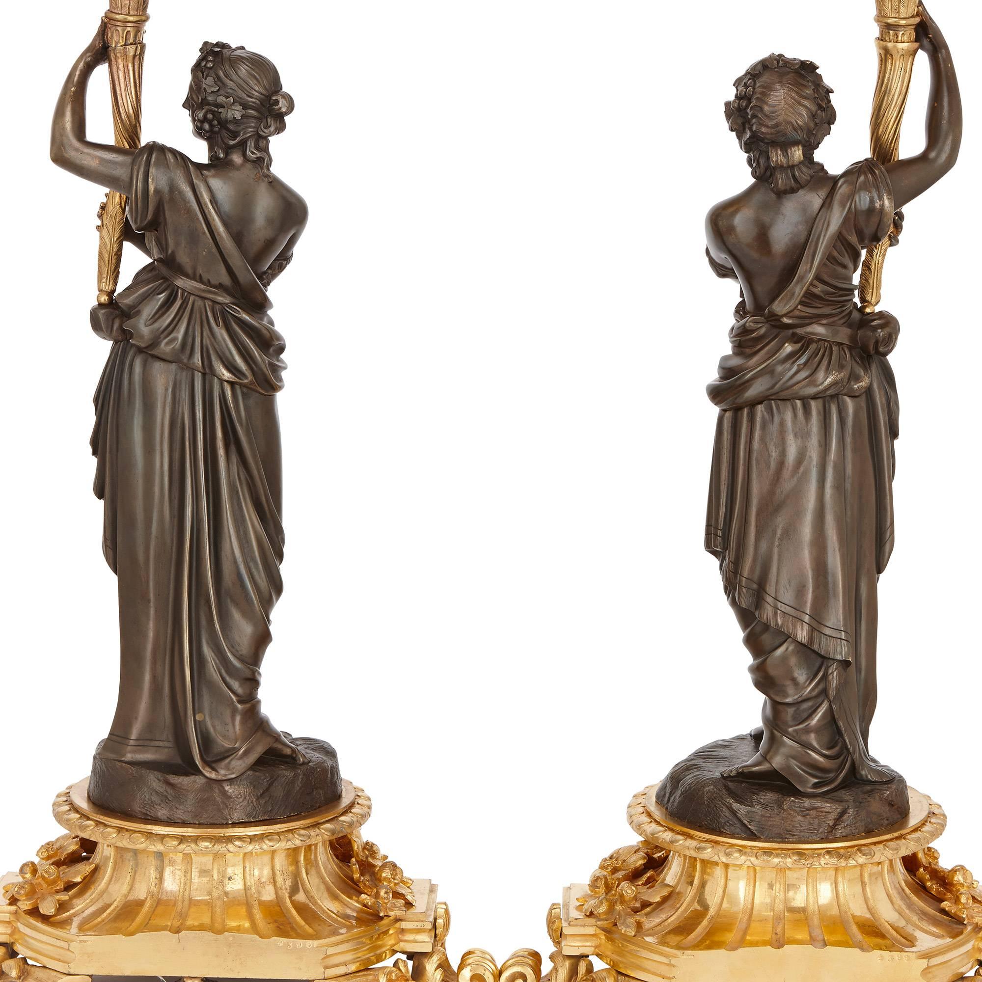 These exceptional antique French candelabra were made by prestigious French maker Henri Picard, who famously supplied works to Emperor Napoleon III of France. Each of the candelabra are modelled as a Classical female figure in patinated bronze,