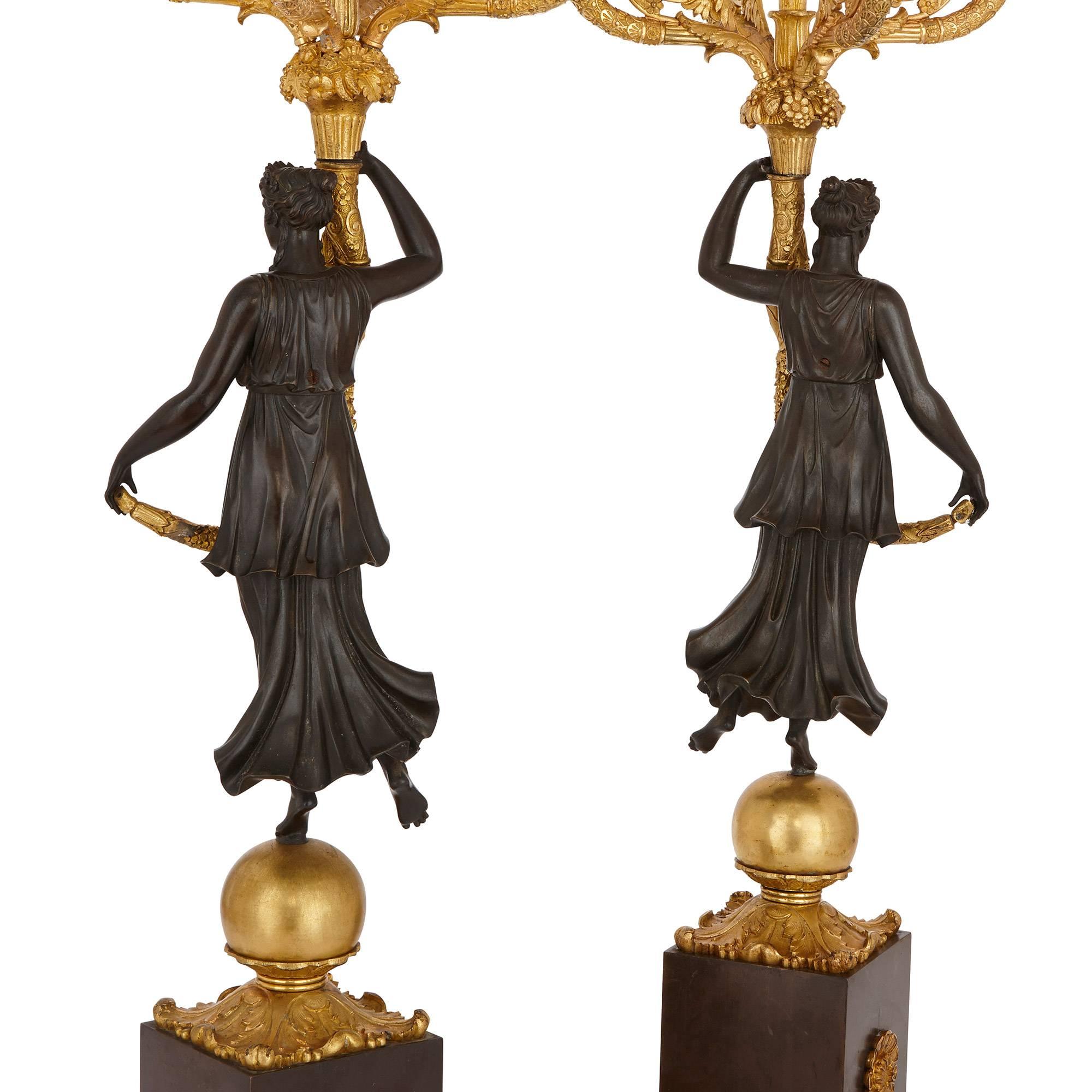 Gilt Pair of Antique French Empire Period Ormolu and Patinated Bronze Candelabra For Sale