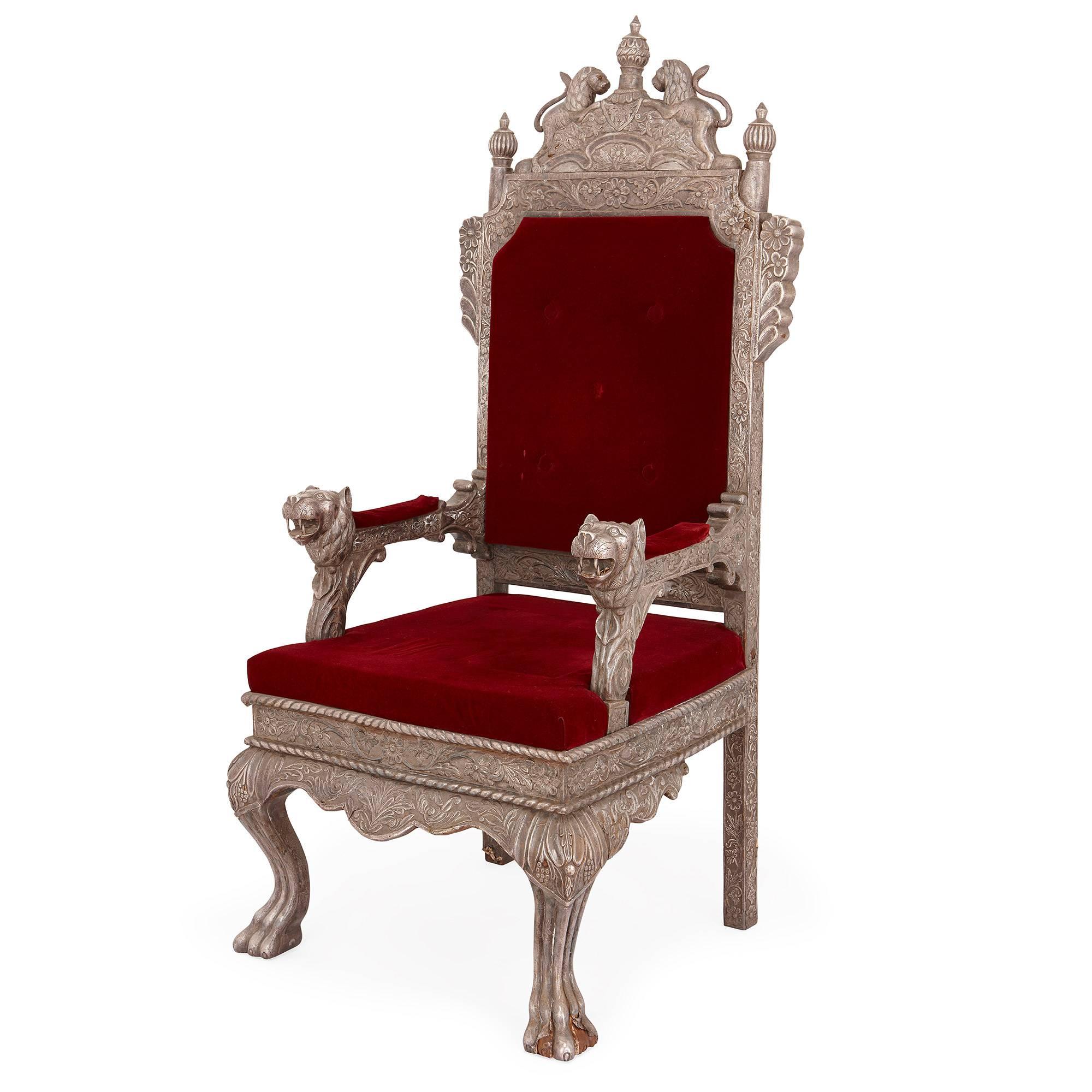 This finely crafted antique Indian silver chair dates from the early 20th century, during the period of British rule in India when European decorative styles, such as the Rococo, were popular among the Indian nobility. It is thought that this chair