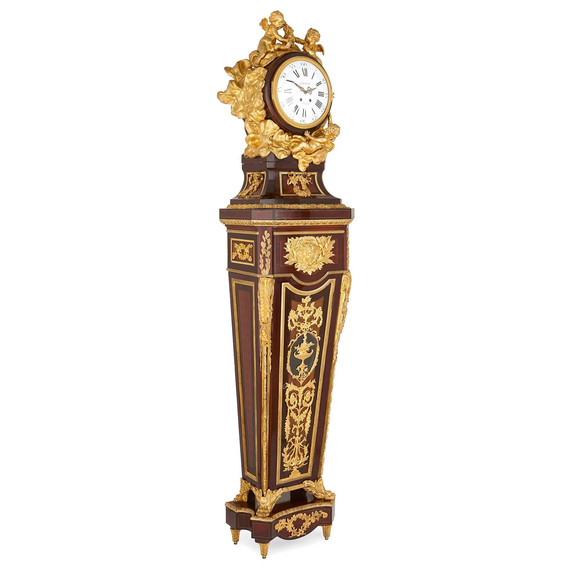 This exquisite gilt bronze-mounted pedestal clock is the creation of the famed French clockmaker Paul Garnier (1801-1861). Garnier worked in Paris during the first half of the 19th Century, and won gold medals at the Paris exhibitions of 1844 and