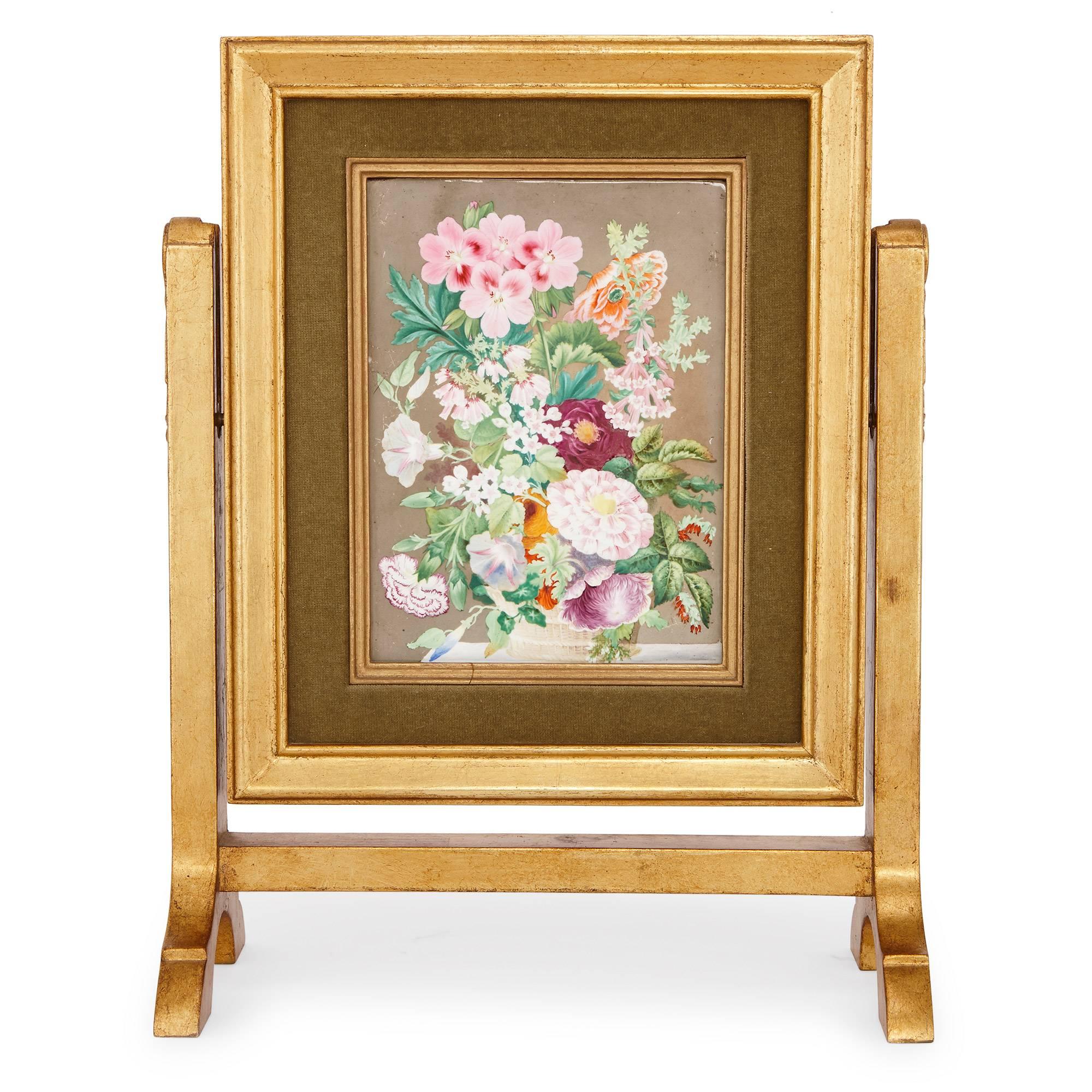 Magnificent still life depictions of flowers adorn both sides of this fine antique porcelain plaque. It is set within a giltwood frame and stand, and there are carved details on the legs of the stand. The plaque can be tilted within its stand. One