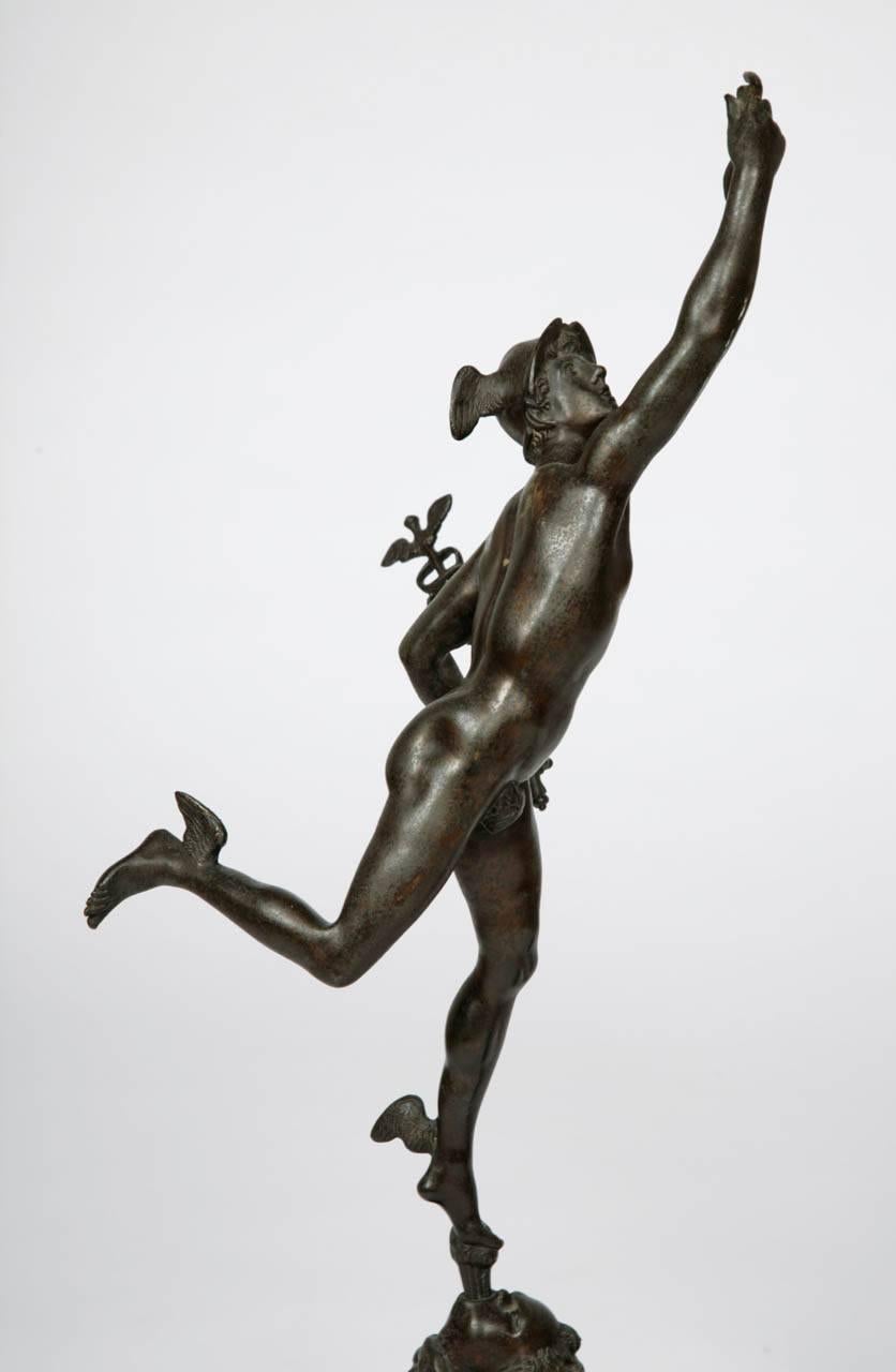 This elegant pair of figures are based on sculptures by the master Renaissance, or Mannerist, sculptor Giambologna (Italian, 1529-1608). Expertly worked from patinated bronze, they depict the Classical Roman figures Mercury and Fortuna. Mercury is