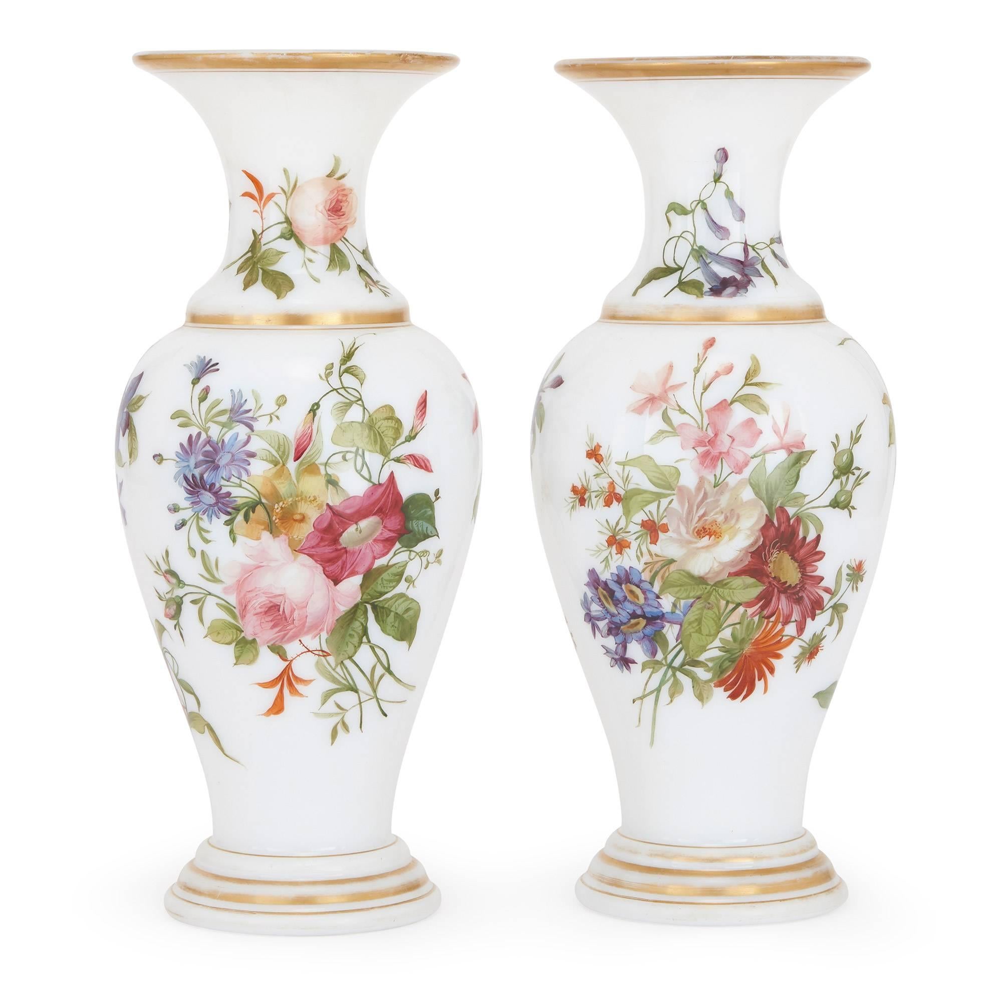 These exquisite 19th century French vases have been attributed to the famed French glass manufacturer Baccarat, the maker of some of the finest pieces of glassware in history. The vases take an ovoid shape, and their bodies are crafted from smooth
