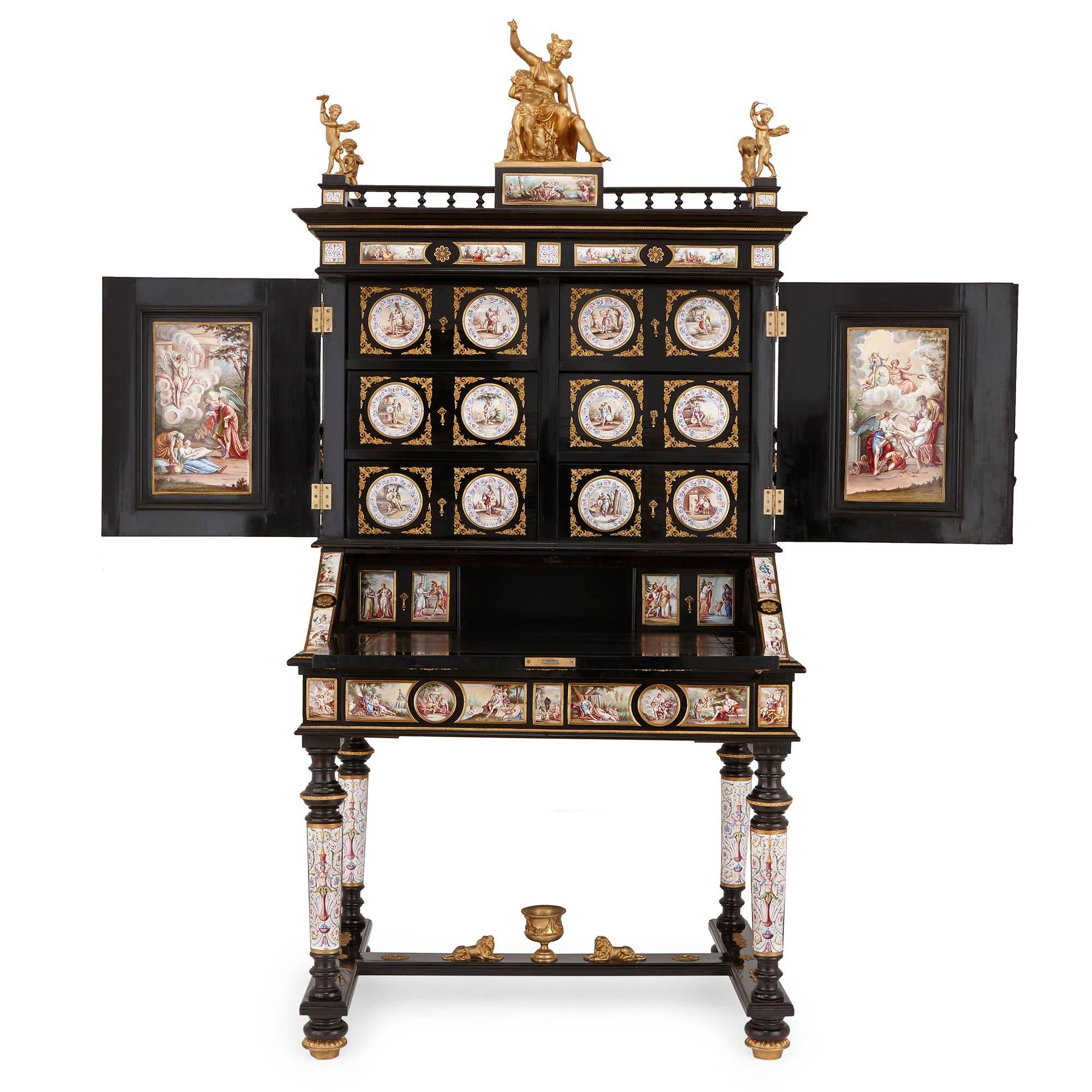 Featuring fine gilt bronze mounts and decorated with intricately detailed Viennese enamel panels of the highest quality, this antique bonheur du jour is truly a masterpiece. The desk stands at over two meters tall, and consists of a rectangular