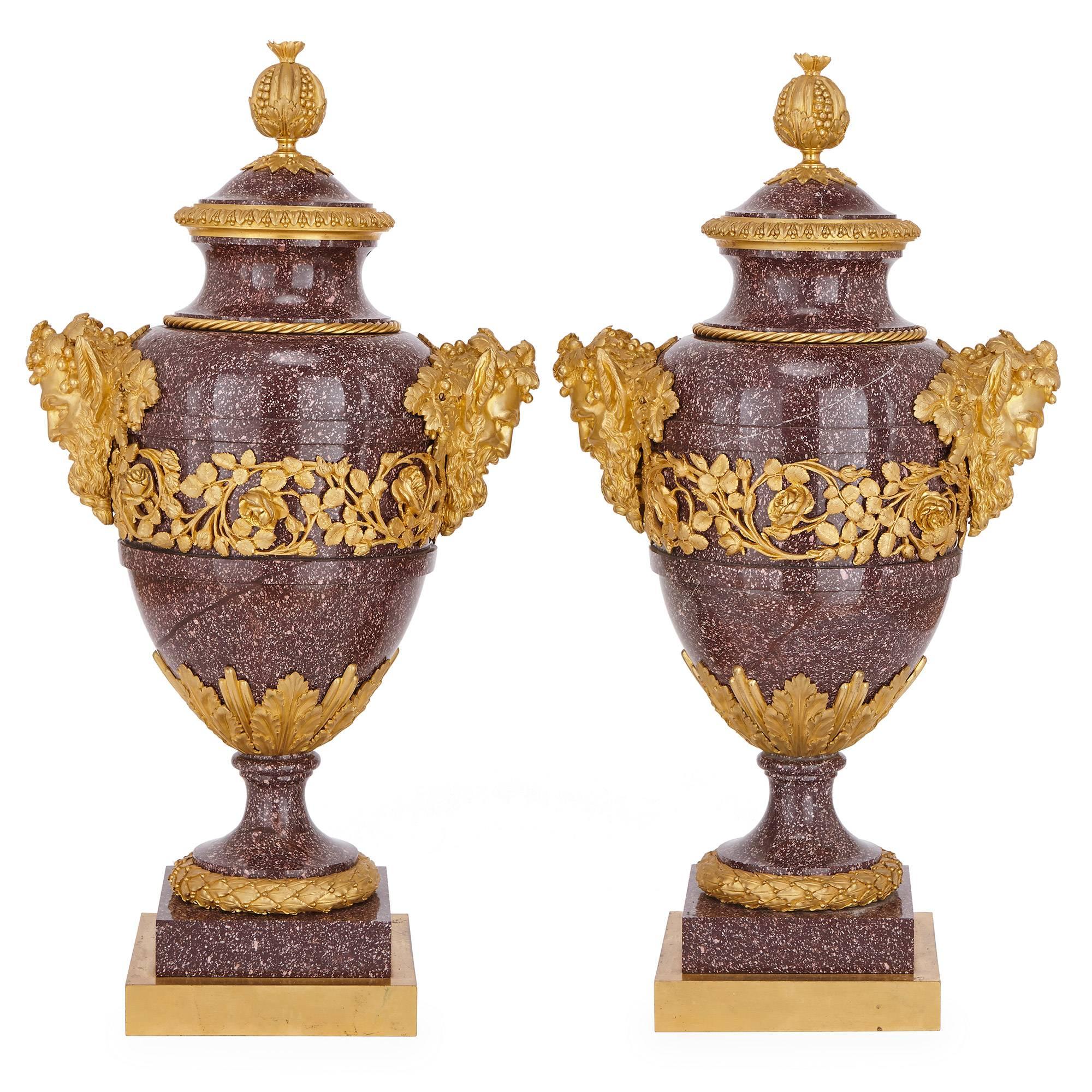 This fine pair of neoclassical style vases are by Maison Millet, the renowned 19th century Paris-based firm, which was established in 1853.
The vases are crafted in a vibrantly coloured porphyry and take an ovoid form. A band of finely cast gilt
