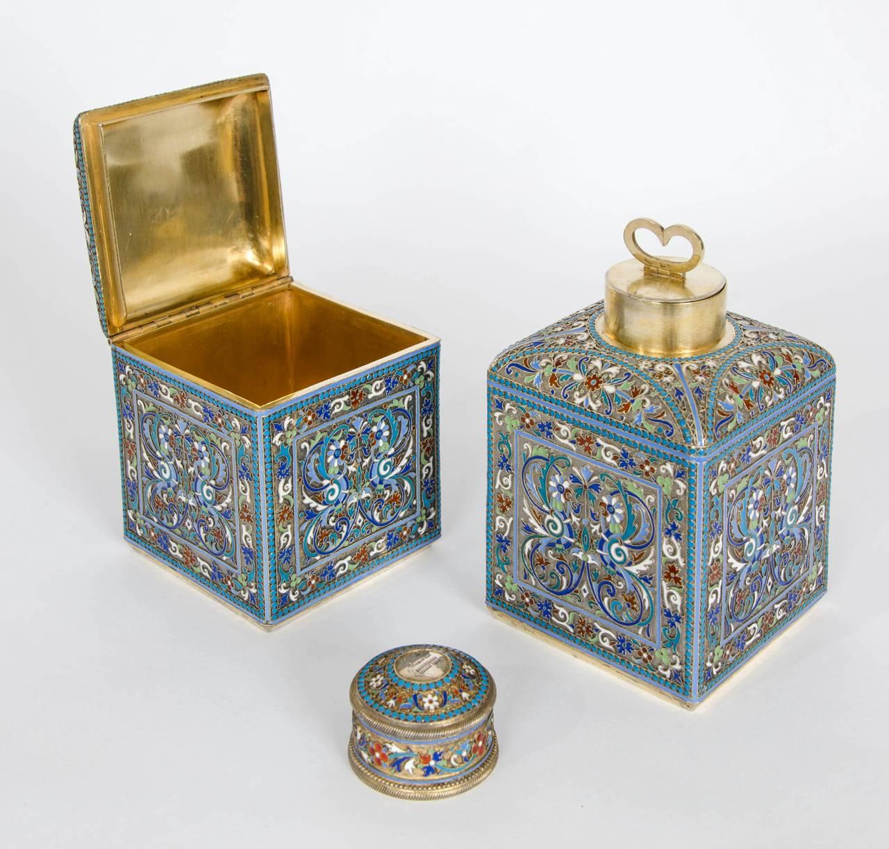 This beautifully enamelled set of two boxes dates from late Imperial Russia, and consist of a tea caddy and a sugar box. These will make excellent additions to a kitchen, and are beautiful decorative objects too. The interior of each box is lined