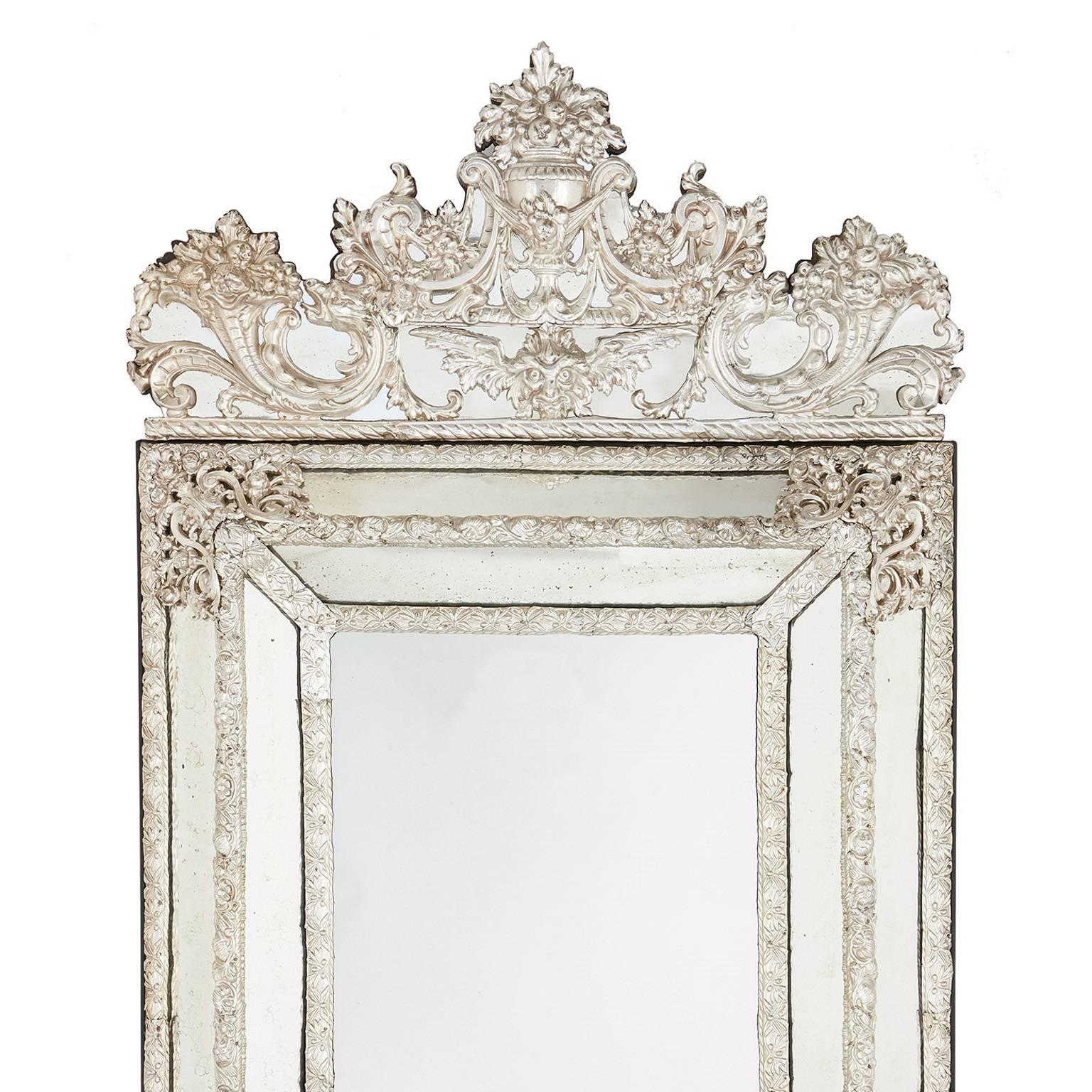 Large rectangular antique silvered French mirror in the Baroque style
French, 19th Century
Height 153cm, width 94cm, depth 11cm

Imitating the Dutch eighteenth century Baroque style, and crafted in France in the nineteenth, this exceptional piece is