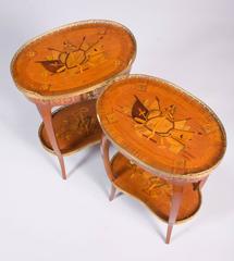 A pair of ormolu mounted rosewood and marquetry two-tiered side tables