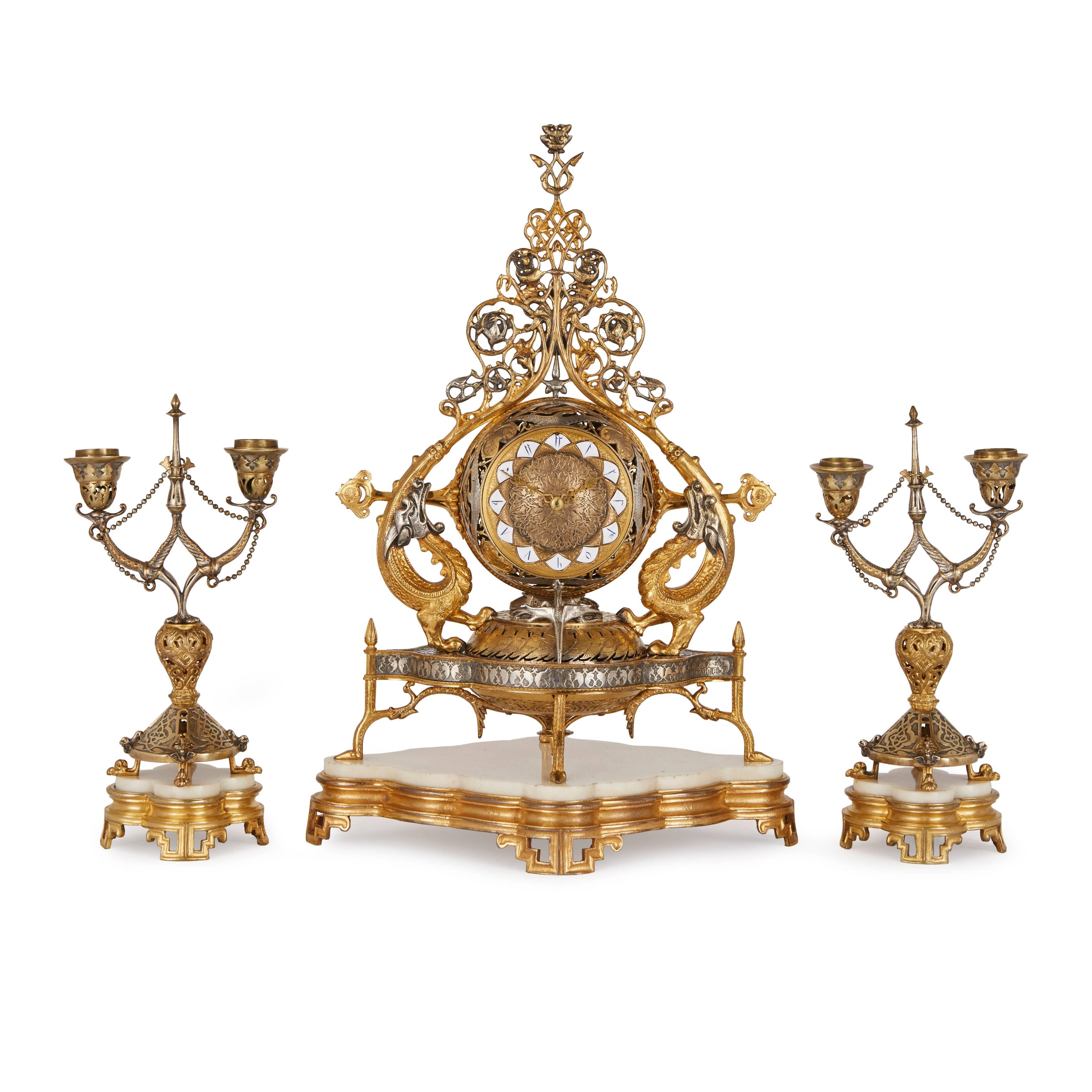 By Dechaume and Delafontaine, in the Persian style, comprising a central clock with a pair of flanking two-light candelabra.
The clock signed Gauffroy Dechaume and the bronze marked AD for Auguste Delafontaine
Clock height 45cm, width 31cm, depth