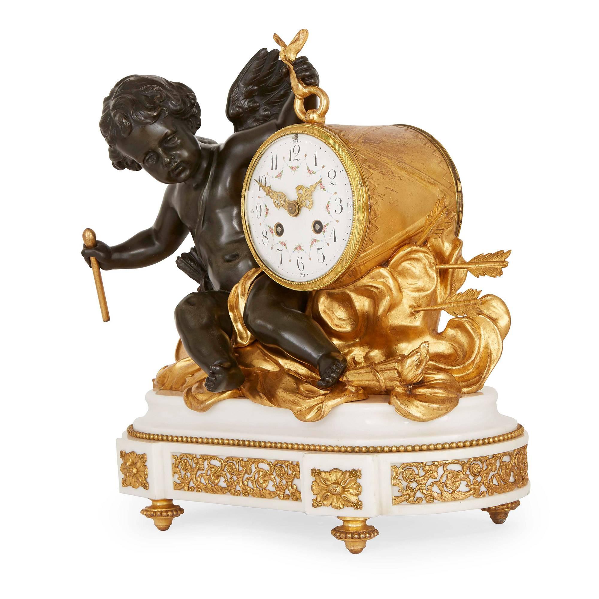 Comprising a central clock and a pair of flanking twin light candelabra, the clock with a bronze putto holding the clock and seated upon various ormolu decorations above an ormolu mounted white marble base, the pair of candelabra similarly