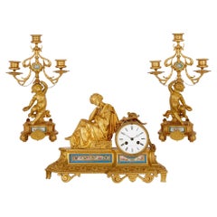 Three-piece French porcelain and gilt bronze clock set