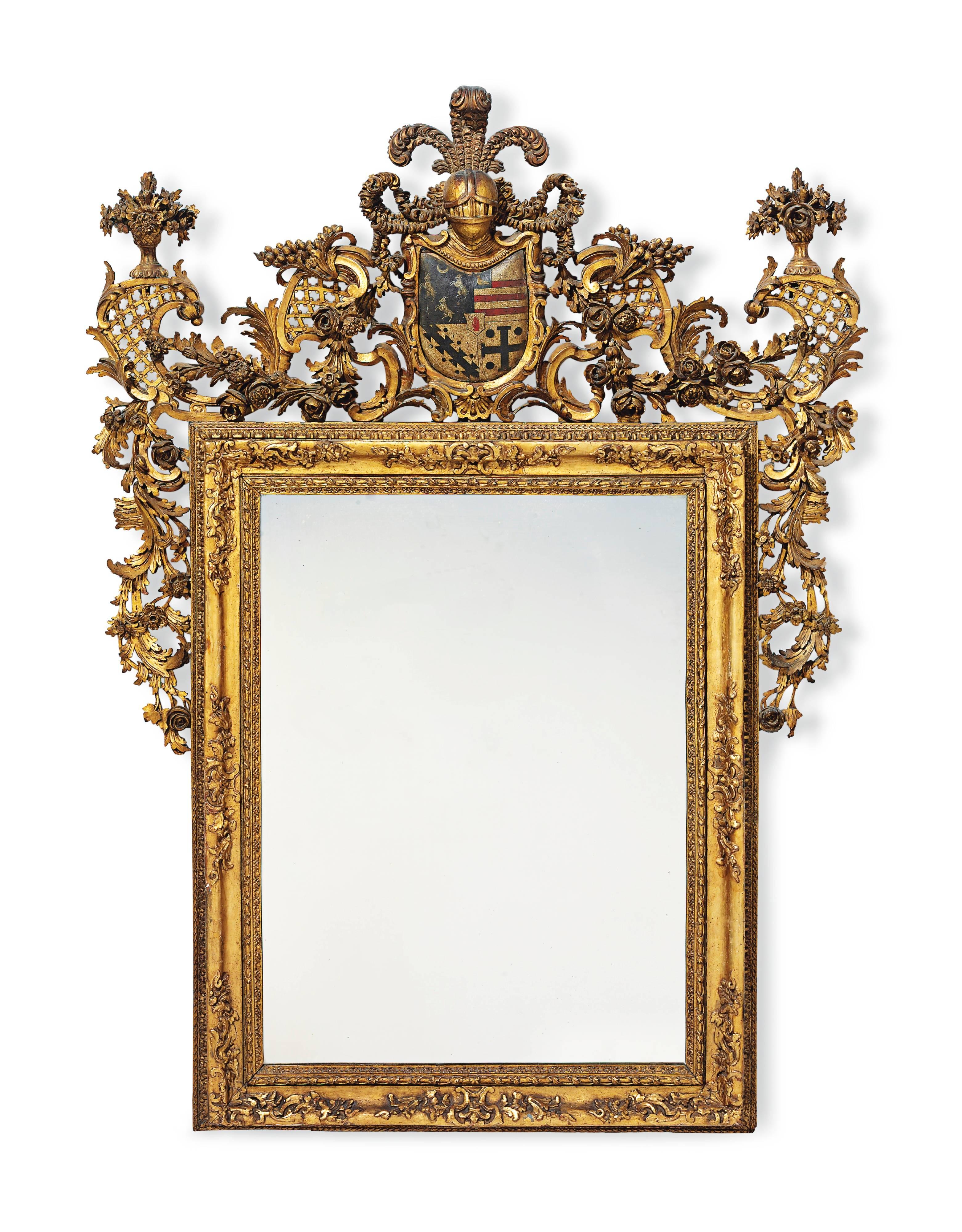 Each with a rectangular plate within a stiff leaf, entwined vine and fleur de lis carved surround, the cresting centred by an armorial shield for the Thorold baronets surmounted by a plummed helmet, flanked by trellis with flower-filled vase finials