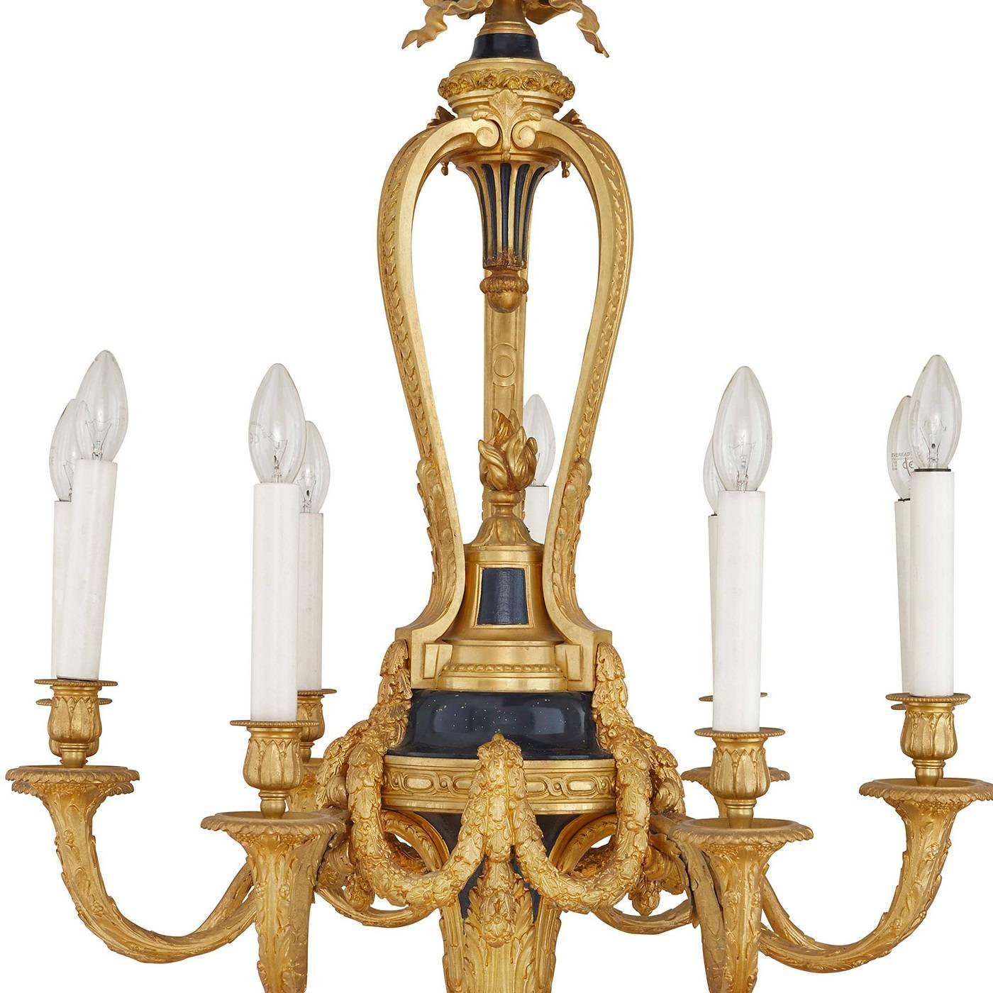 This elegant chandelier, decorated in the typical Belle Époque fashion, embodies the glamorous and luxurious lifestyle led by French nobility in early 20th century Paris. The nine ormolu branches are decorated with delicate foliate motifs and