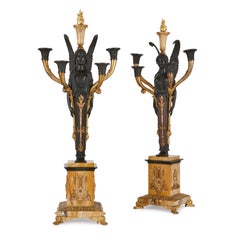 Paire de candélabres Empire en bronze doré et patiné