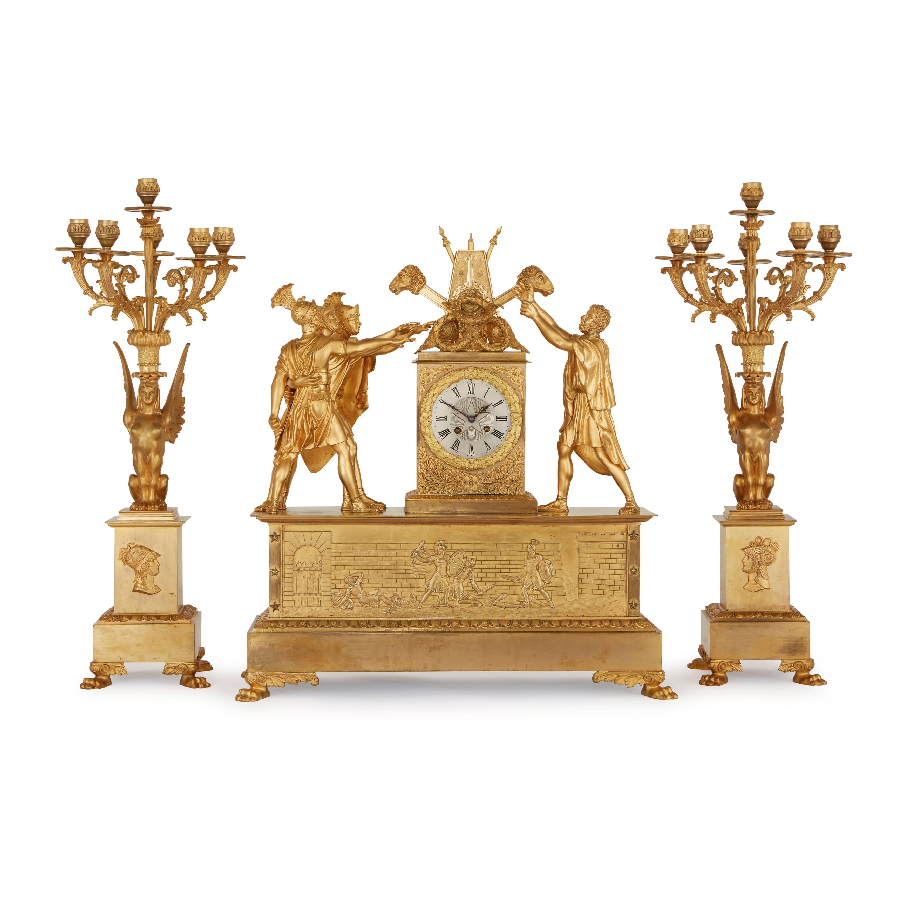 This exquisite 19th century trio is comprised of a central clock and a pair of flanking six-light candelabra. 

The design of the clock case is widely acknowledged to be inspired by one of the most important paintings of French Revolution, ‘The