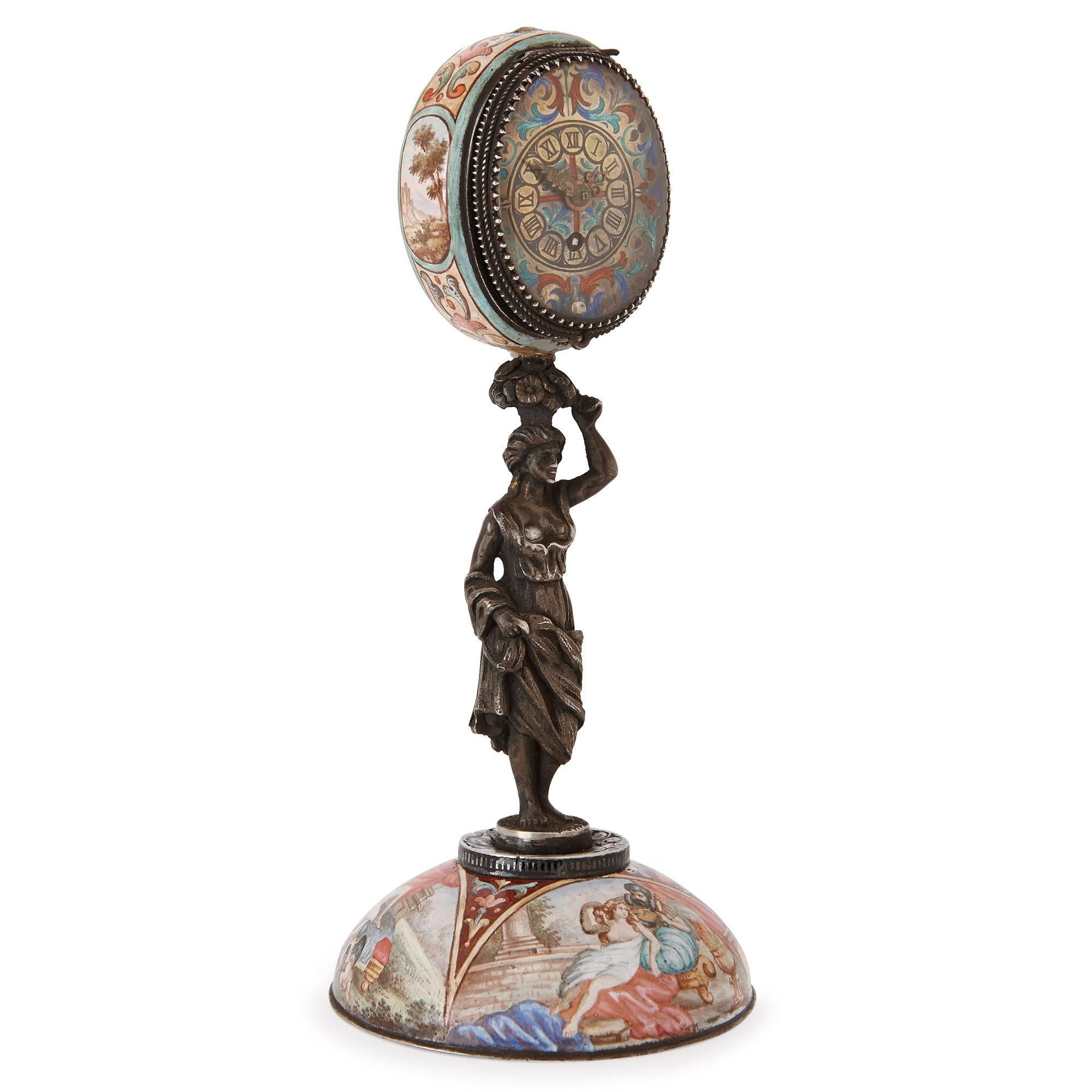 This 19th century, Austrian table clock is crafted in silver and the complex champleve enamel technique. The base of the clock is a semi-spherical dome inlaid with enamel panels of classical figures and landscapes. The central support for the clock