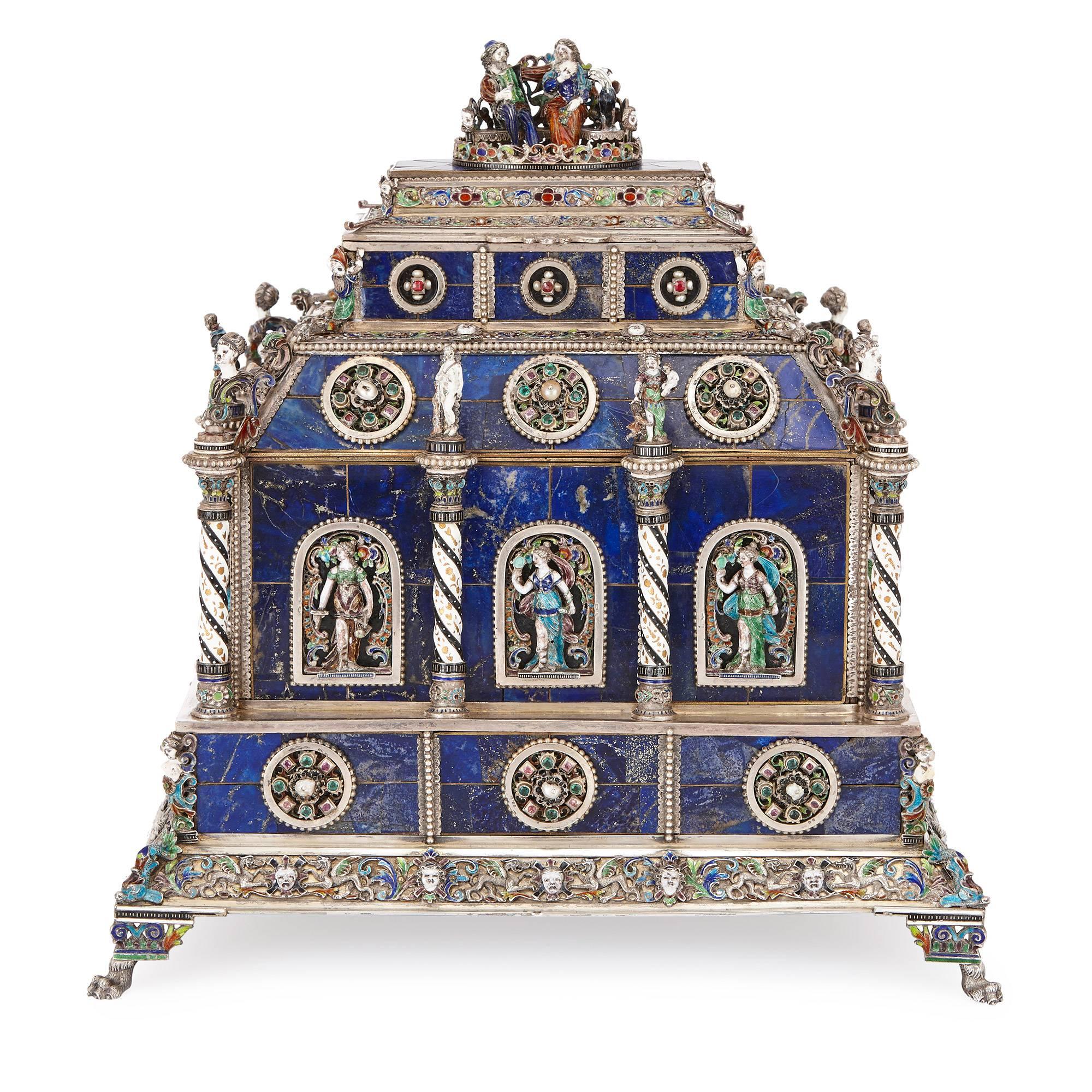 This fine, antique Viennese casket is ornately crafted in precious lapis lazuli and silver mount by Herman Bohm, an Austrian maker active in the latter half of the 19th century. The hinged lid of the casket is surmounted by a couple sitting on a