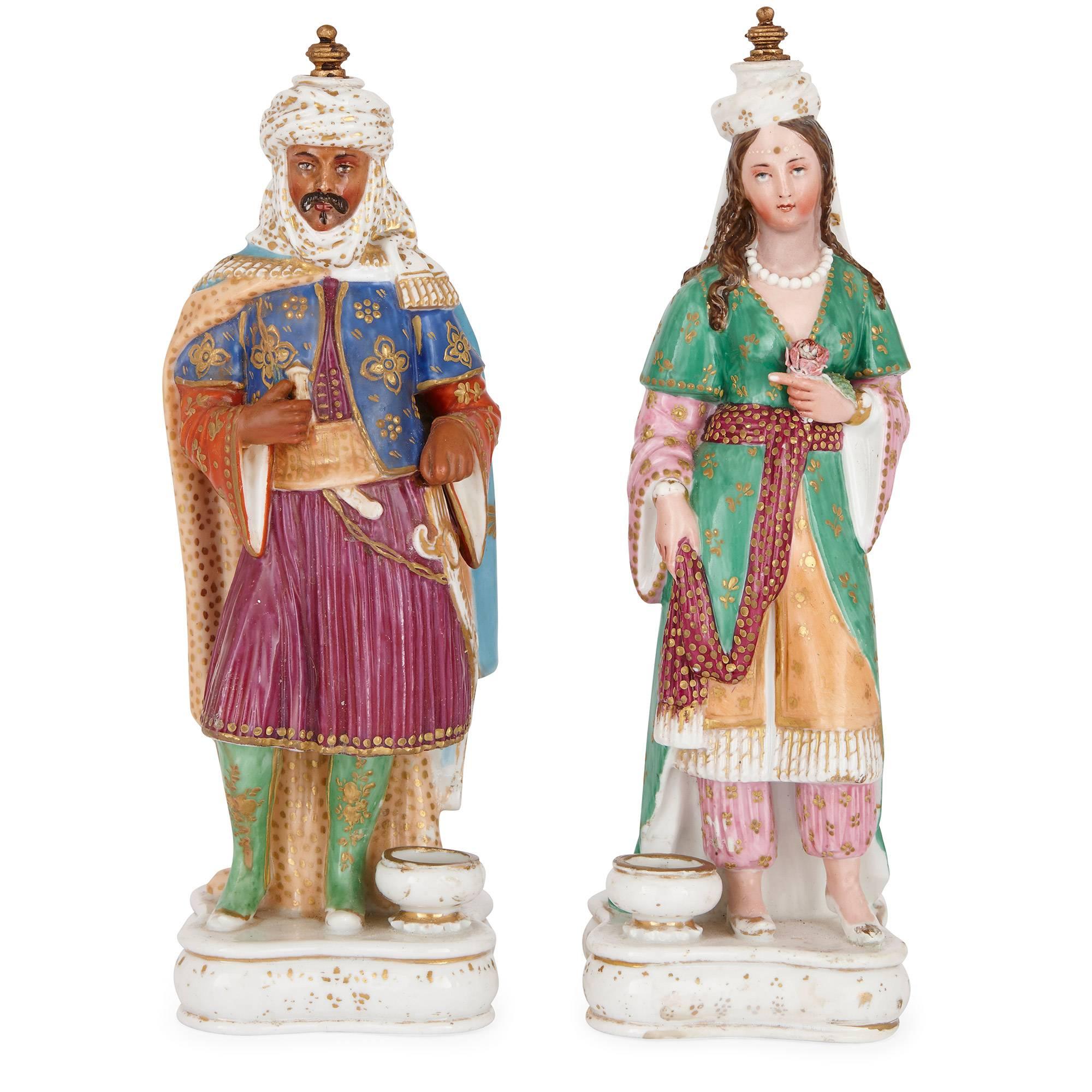 This pair of antique porcelain perfume bottles are made entirely of porcelain by Jacob Petit, a renowned maker who trained at the Sevres Manufactory. The bottles are styled as a man and a woman in Turkish wedding dress with poly-chromatic paint and