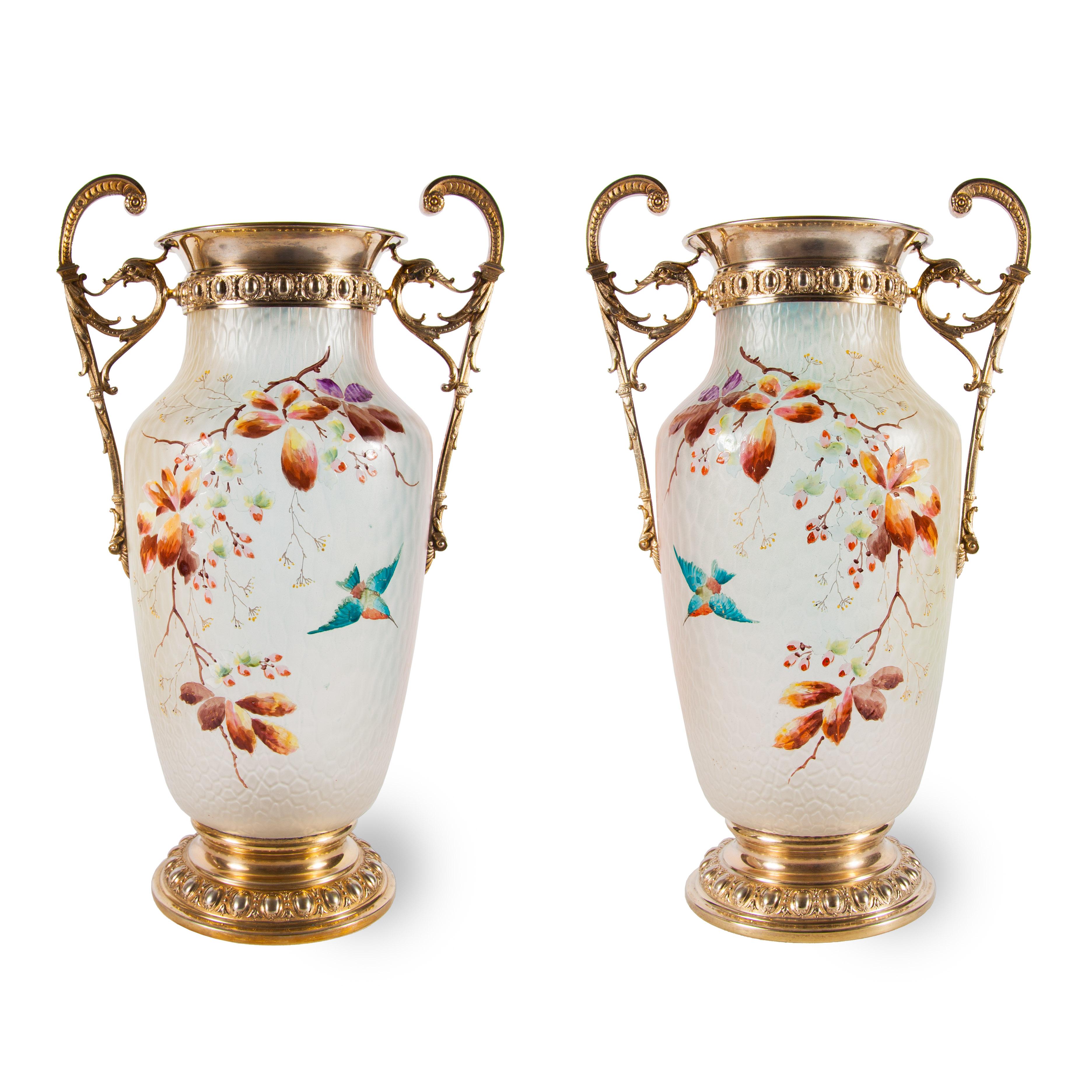 These modern looking vases have a fantastic fin-de-siecle splendour, mainly owing to the fine combination of frosted glass and enamelled decorations which adorn their bodies. Each vase is mounted with gilt brass, on its circular base, its rim and