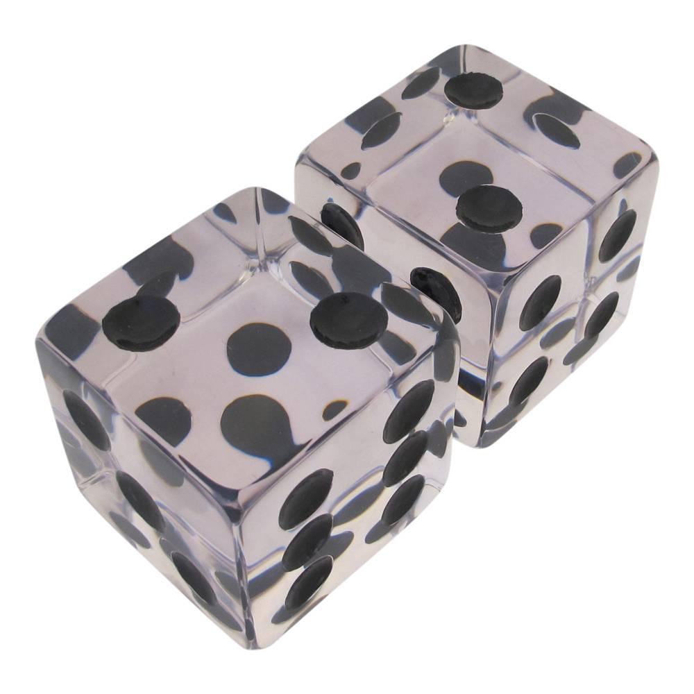 Lucite dice bookends, USA, 1970s. Having rounded corners and good weight. Repainted numbers. Light scratches.