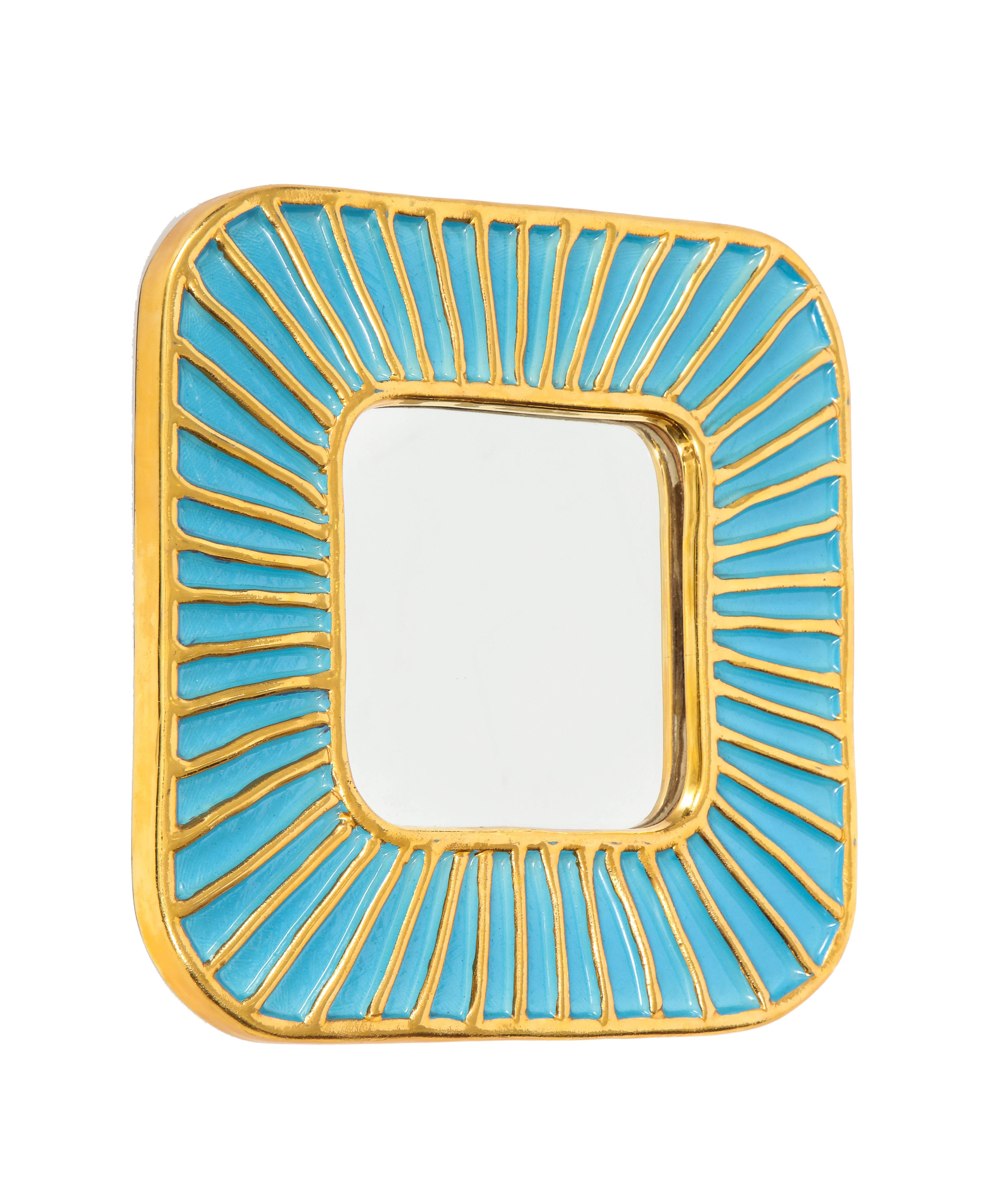 Francois Lembo ceramic mirror turquoise gold signed France, 1970s. Turquoise glaze ceramic mirror with gold sun ray pattern. Signed Lembo in script on verso of the mirror.

A native of Vallauris François Lembo started his pottery career in 1951 in