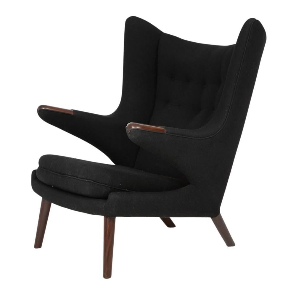 Hans Wegner Papa Bear chair and ottoman teak A.P. Stolen signed, Denmark 1960s. Purchased directly from the original owner via an auction. Covered in the original black wool fabric and even retains two black replacement upholstery buttons sewn into