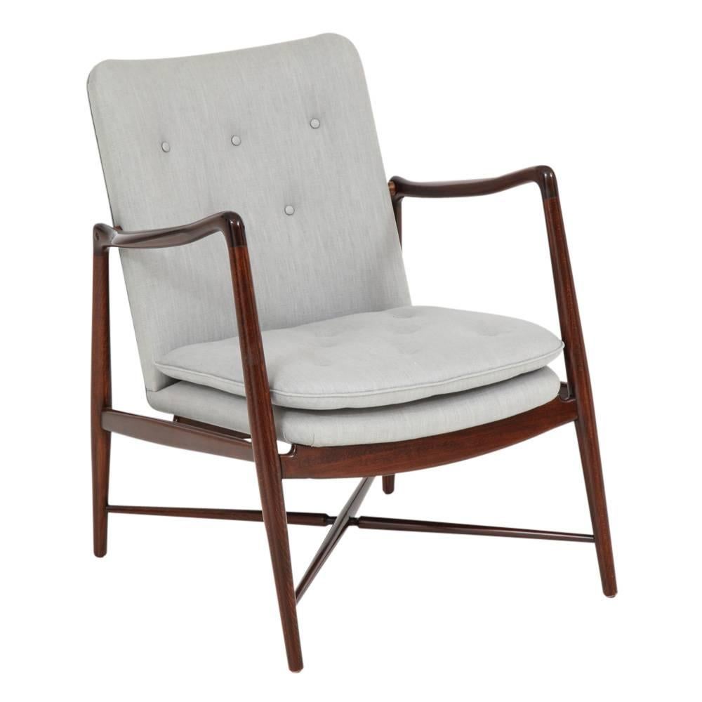 Finn Juhl BO-59 beechwood and upholstery lounge chair for Bovirke, Signed Denmark, 1950s. Originally purchased at Georg Jensen's 5th Avenue showroom in Manhattan. Reupholstered in gray fabric to the original button configuration. Refinished