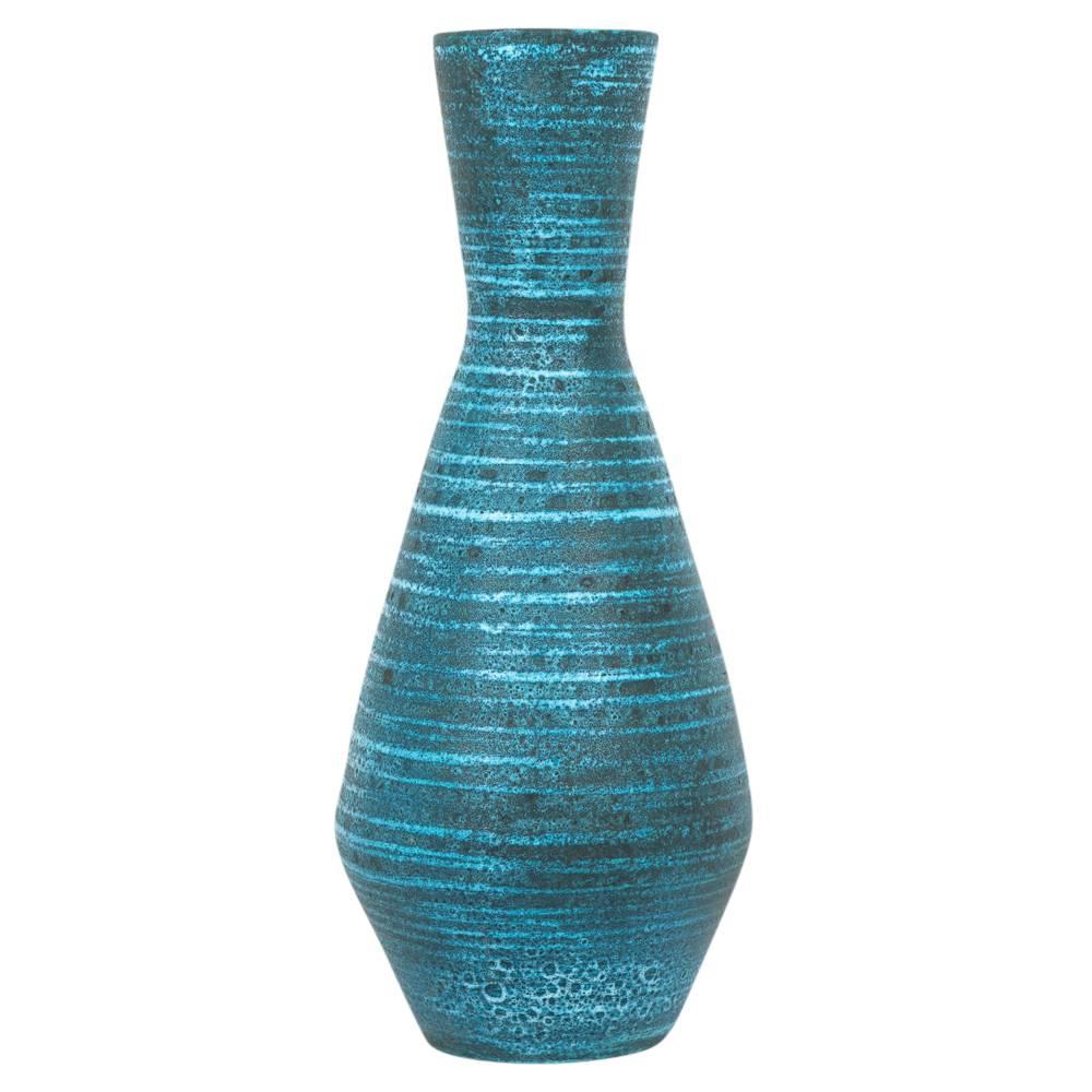 Accolay Ceramic Pottery Vase Blue Signed France 1960's. Tall tapered hourglass form vase with rich indigo glaze. Signed on the underside of the vase. In the 1960's travelers could find Accolay vase in the French countryside, as pictured in photo 5. 