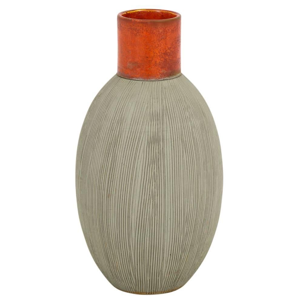 Raymor Bitossi vase ceramic orange signed. Pale green glazed oblong shaped body with incised decoration nicely contrasted with an orange/red glazed cylindrical neck. Signed on the underside: 