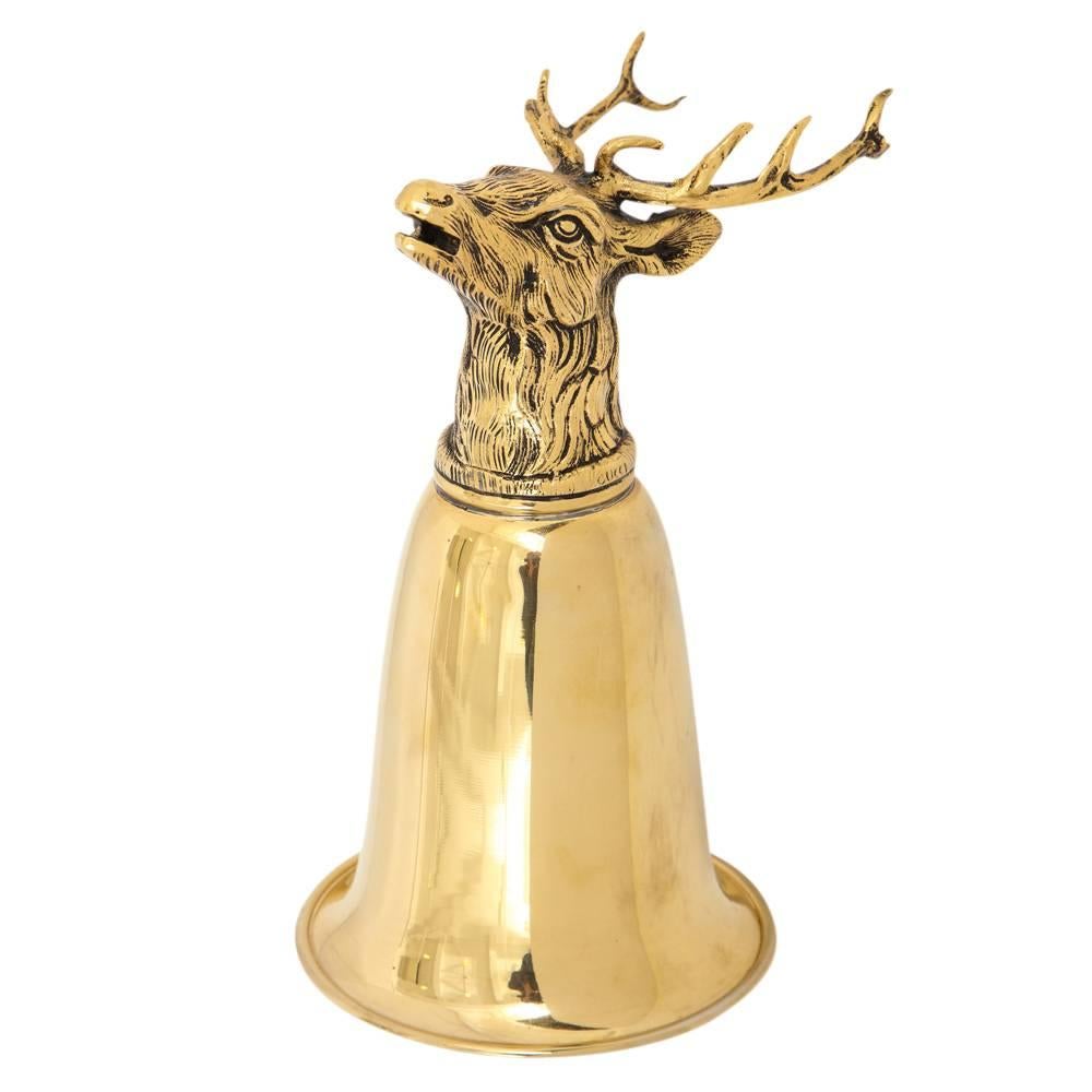 Gucci stag brass stirrup cup signed, Italy, 1970s. Can be displayed as pictured or with the cup upside down, resting on the stag's antlers. Signed Gucci with impressed marked.
 