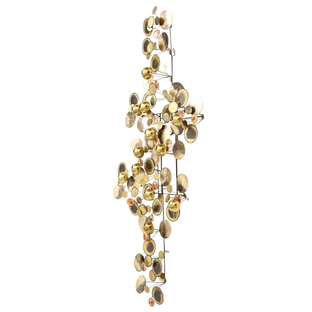 C. Jere raindrops sculpture brass bronze signed, USA, 1970s. Signed C. Jere on one of the brass discs. A large wall sculpture in excellent original condition with great patina. The raindrops sculpture is part of the iconic line of home goods