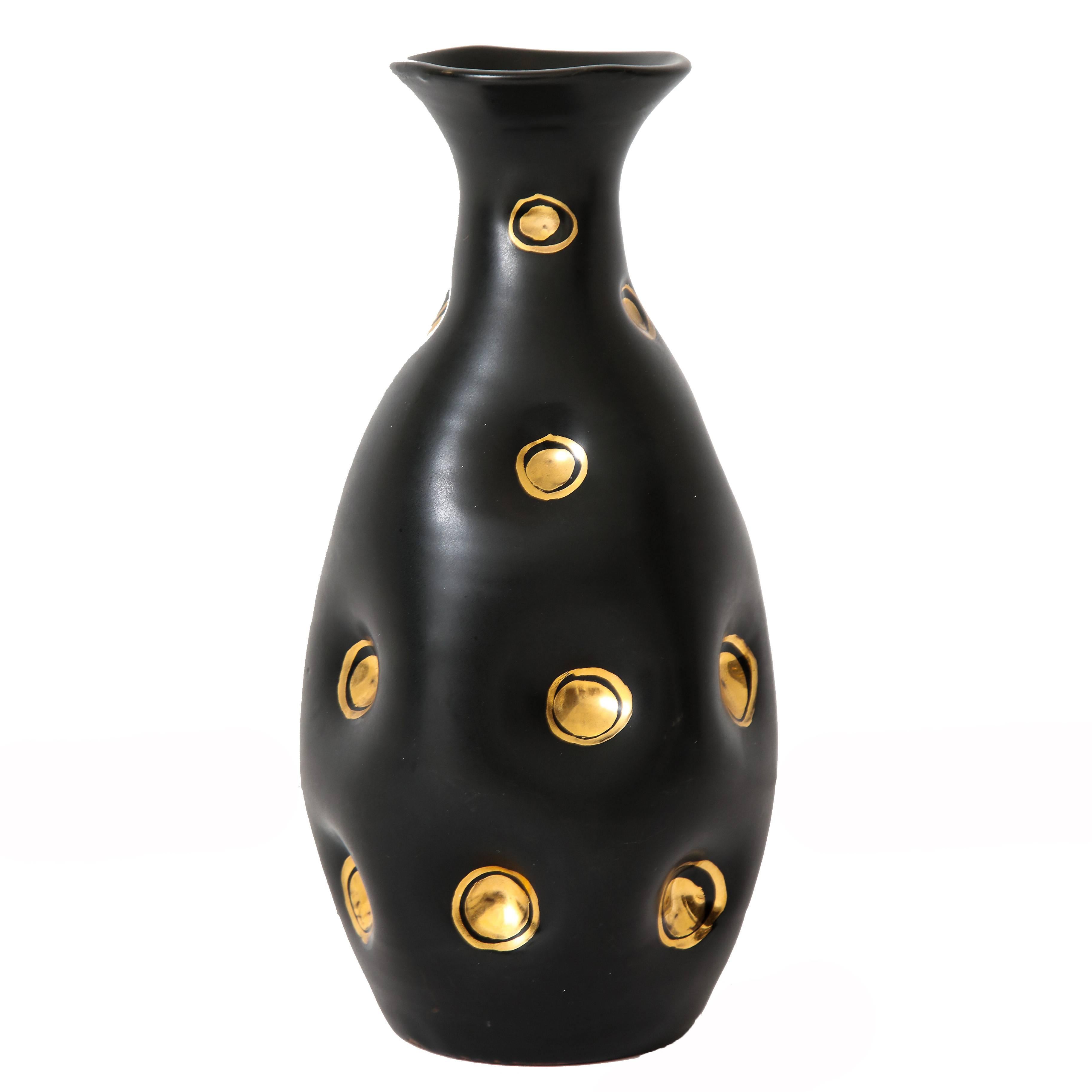 Bitossi ceramic vases pinched black gold signed, Italy, 1960s. Pair of black glaze vases with pinched bodies and recessed circular gold glaze decorations. Marked on undersides of both vases V 290/25 Italy.