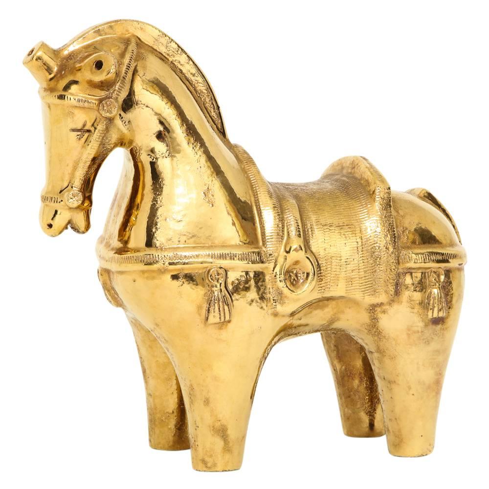 Bitossi ceramic horse sculpture gold glaze pottery, Italy, 1950s. Extremely rare in solid gold glaze. At 18 inches in length, it was the largest size Bitossi produced.
Most likely designed by Aldo Londi, Bitossi's lead designer for many years from