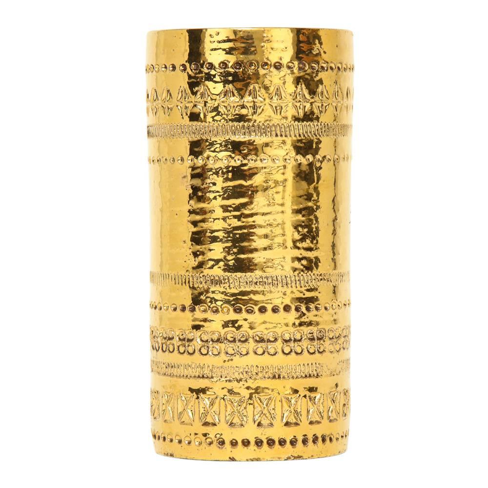 Aldo Londi Bitossi vase, ceramic, gold metallic, signed. Small cylinder vase decorated with bands of impressed geometric patterns and glazed in metallic gold. The Bitossi factory mixed 24-karat gold to achieve the luster to their gold glazes.