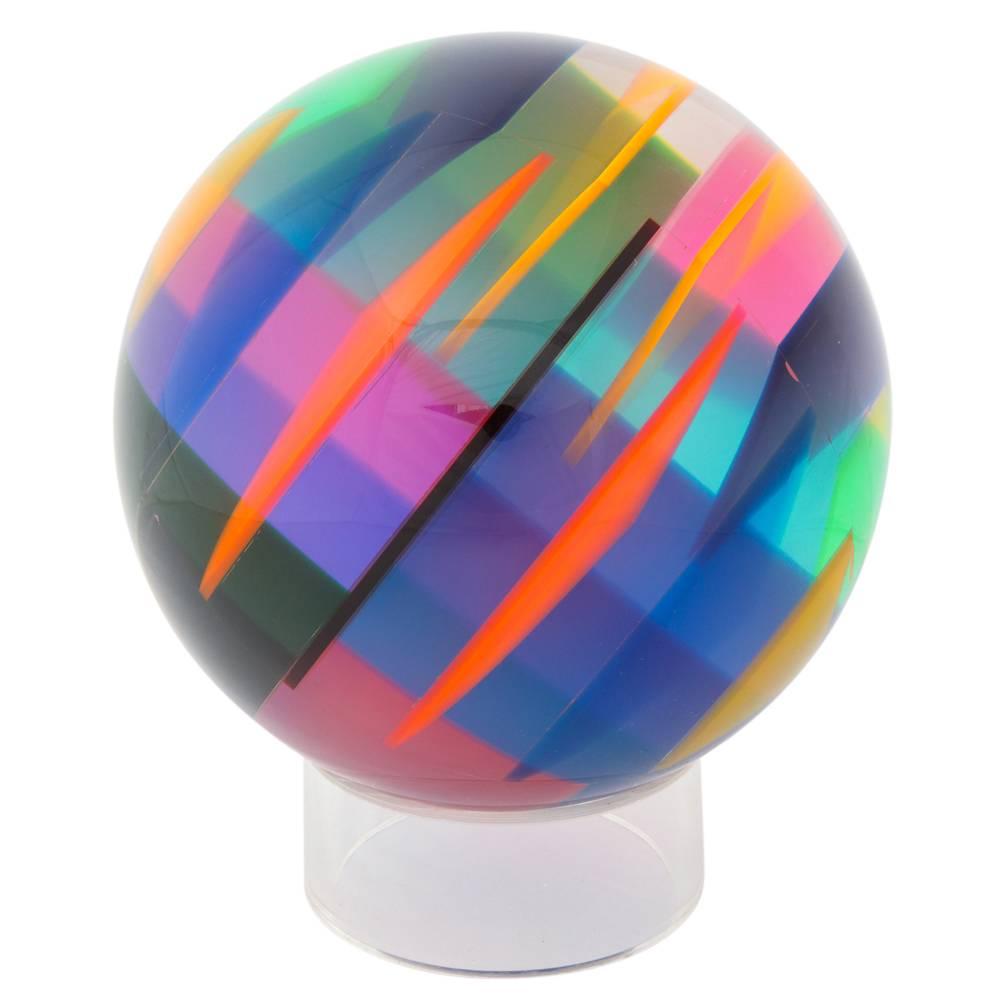 Vasa Mihich sphere, cast acrylic, blue, magenta, orange, signed. Large tabletop sculpture by vase composed of laminated cast acrylic sphere with an array of internal wedge shape colors. The colors change depending on the light. Signed #1082 Vasa