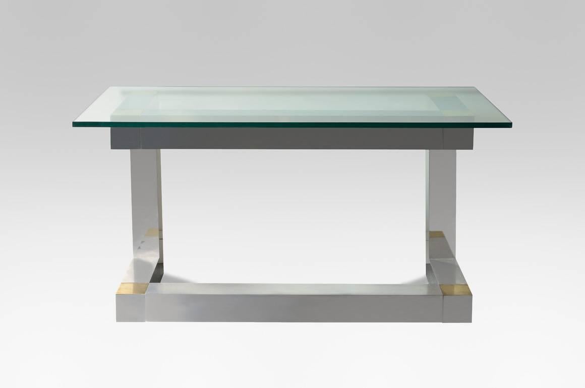 Cityscape console model for Directional by Paul Evans (1931-1987, USA),

1978.

Chromed brass and steel.
Glass top.

Base dimensions: 47 x 28 x 18 in. (121 x 72 x 46 cm).
Total size: 28 x 55 x 25 in. (72 x 141 x 65 cm).