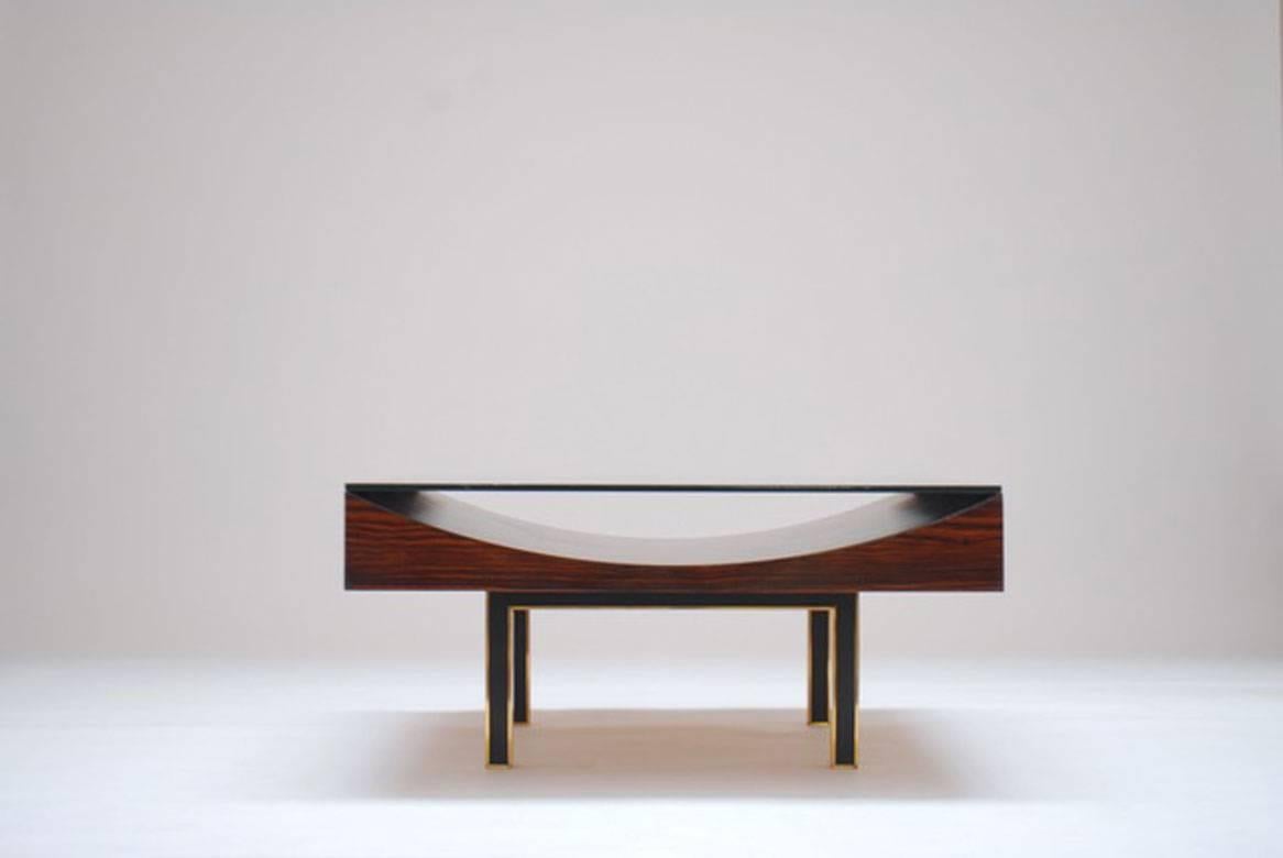 Modernist pair of coffee tables by Joaquim Tenreiro (1906-1992)
1967
Macassar wood, copper base et top glass
Measures: 100 x 100 x 45 cm
In good condition

Historical: This is a special order in 1967 for the residence of the King and Queen of