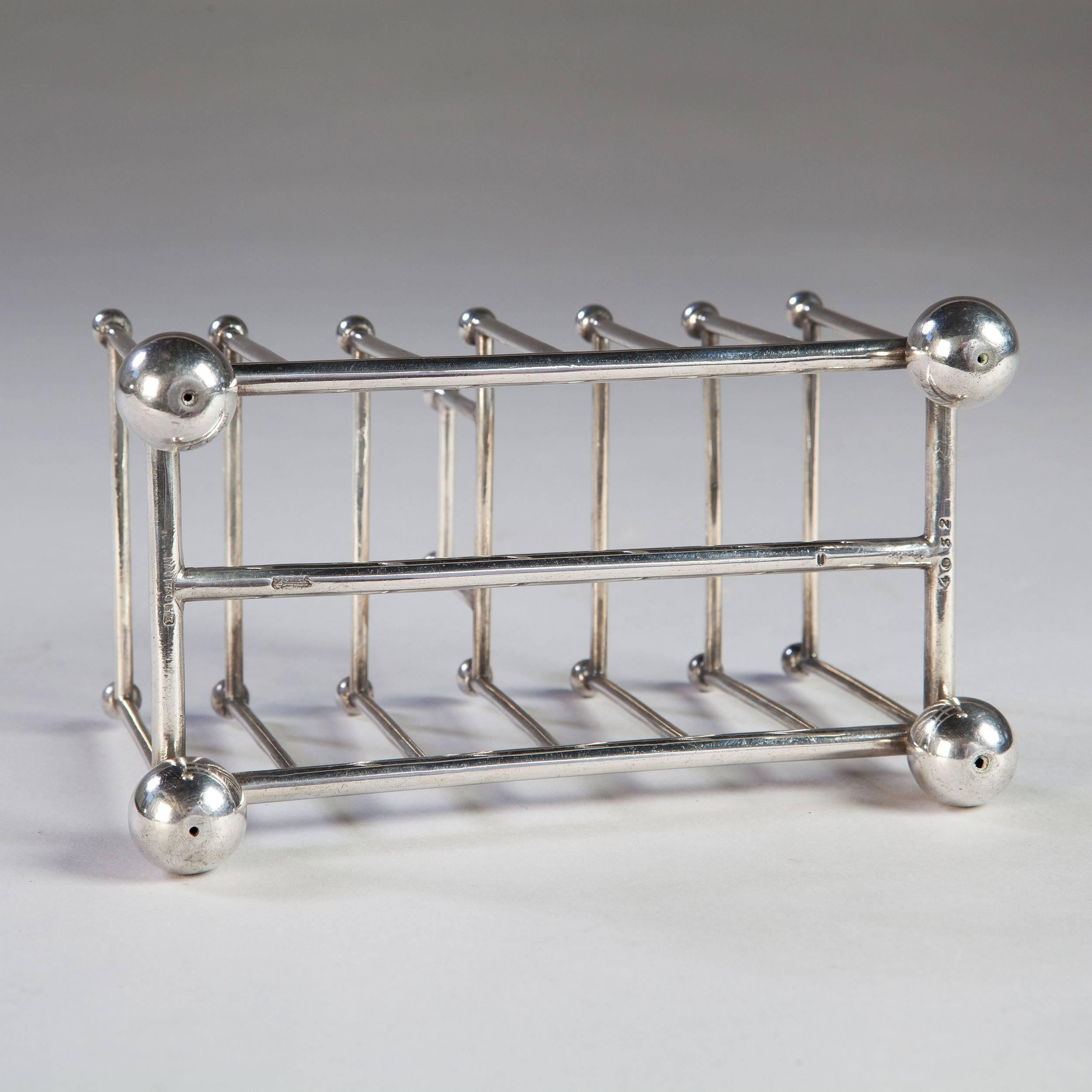An early 20th century silver plated toast rack, attributed to Christopher Dresser.